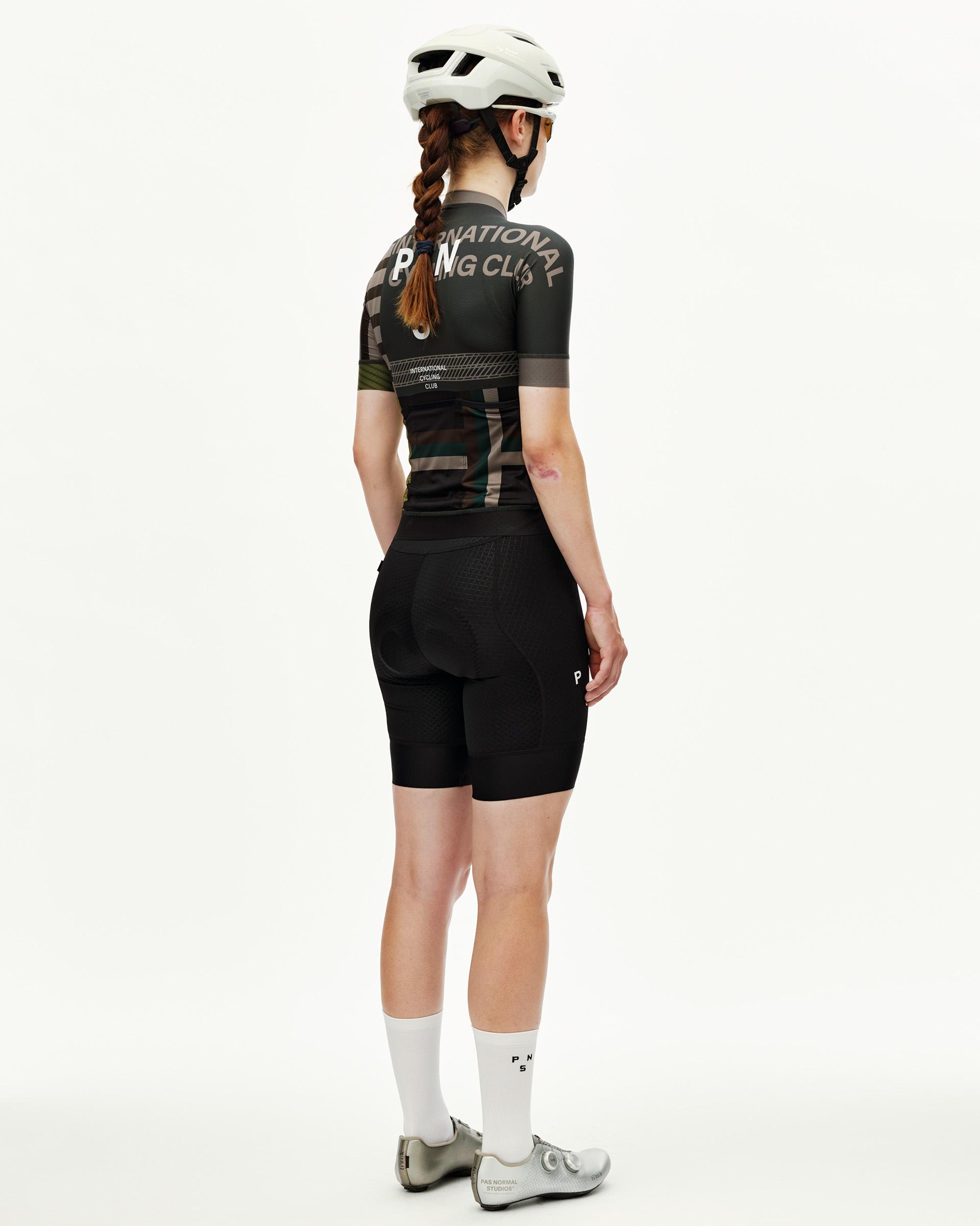 International Earth PAS Mechanism women's cycling jersey on model, rear view with graphic print
