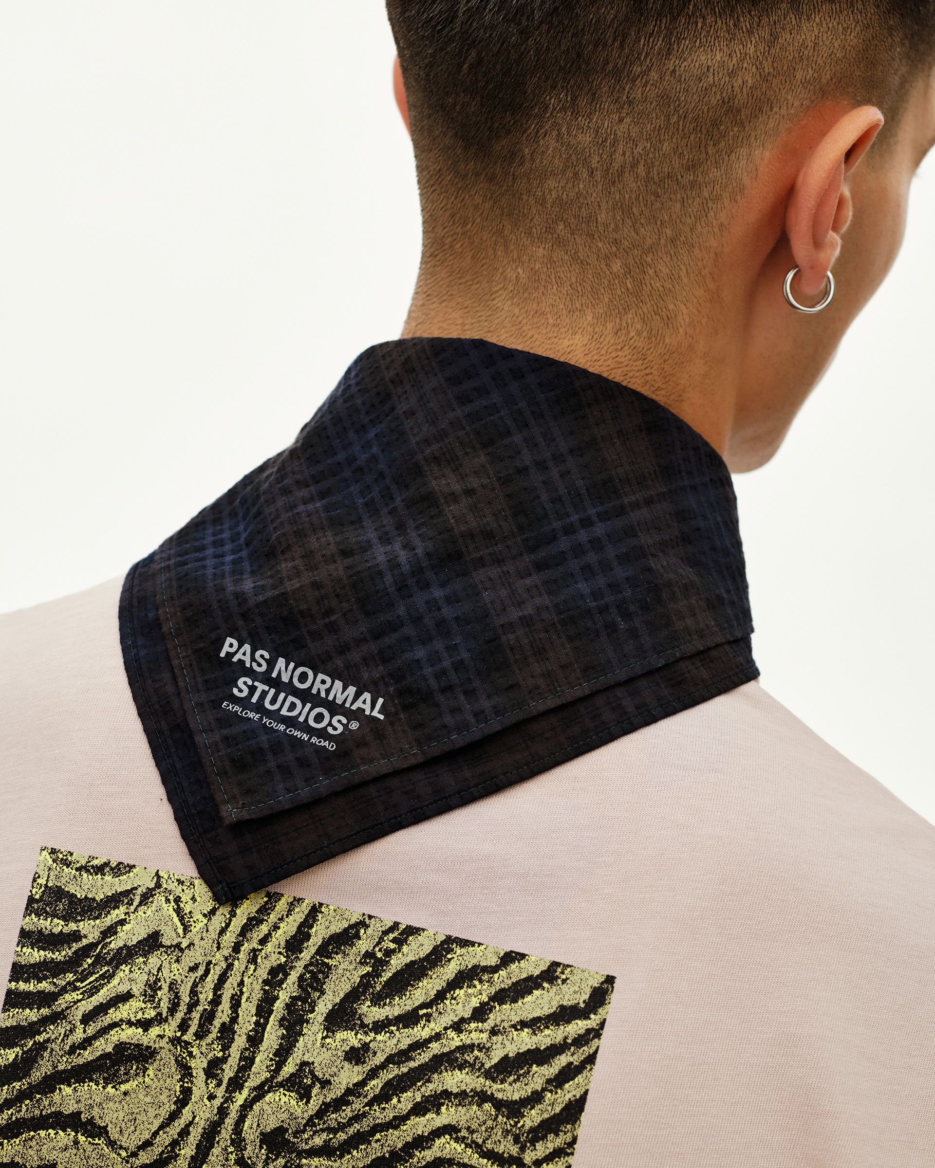 Dark Navy Off-Race Seersucker Bandana, rear detail view on model showing grid-texture fabric and branded logo print