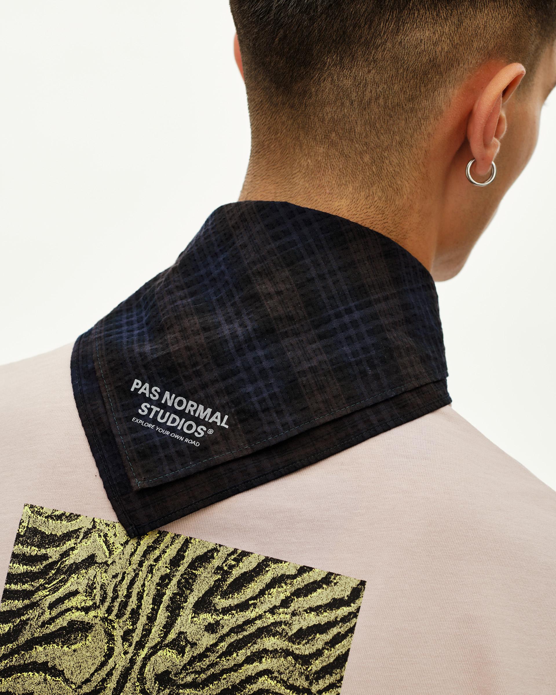Dark Navy Off-Race Seersucker Bandana, rear detail view on model showing grid-texture fabric and branded logo print