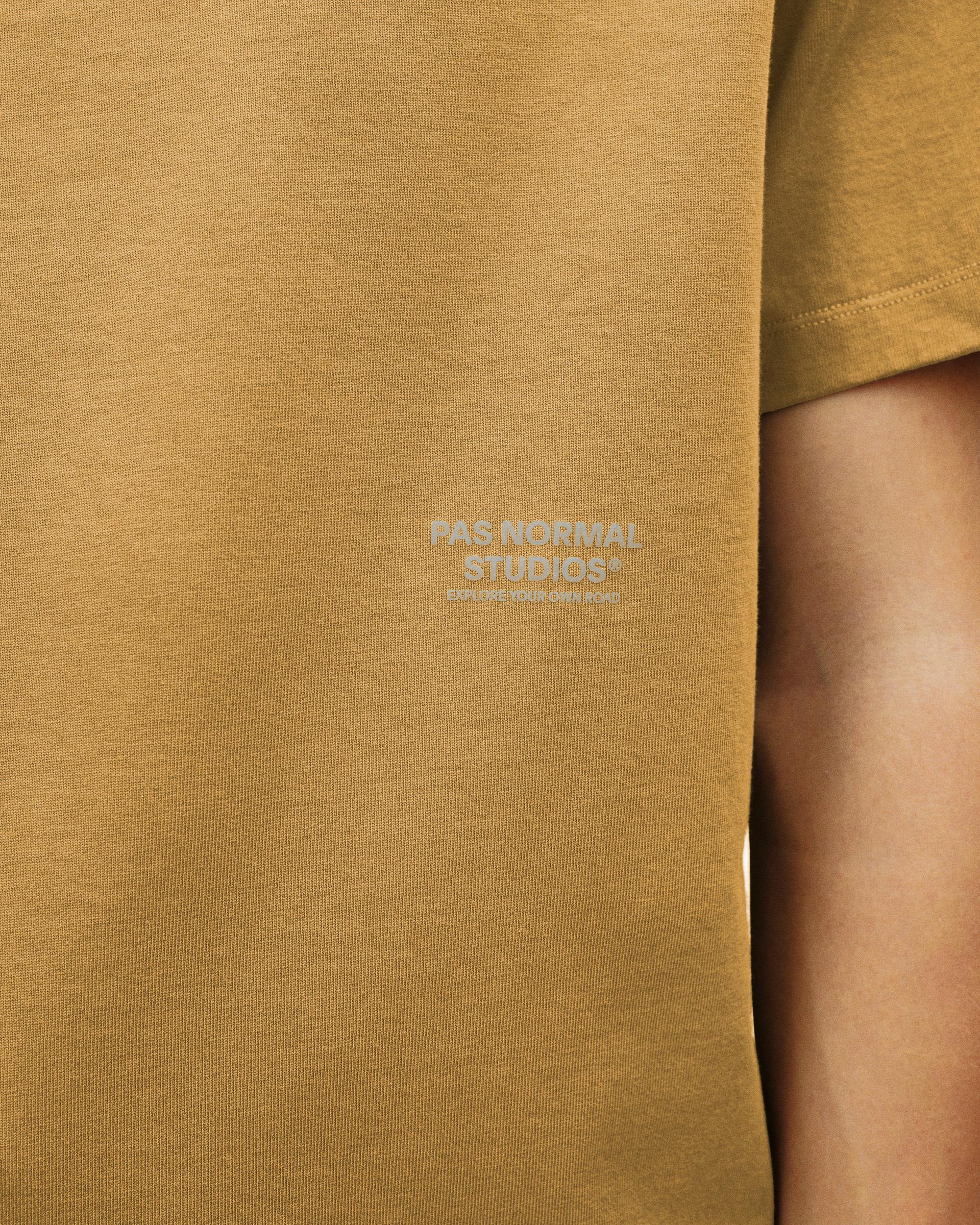 Brown Off-Race T-shirt, chest detail view on model with tonal logo print