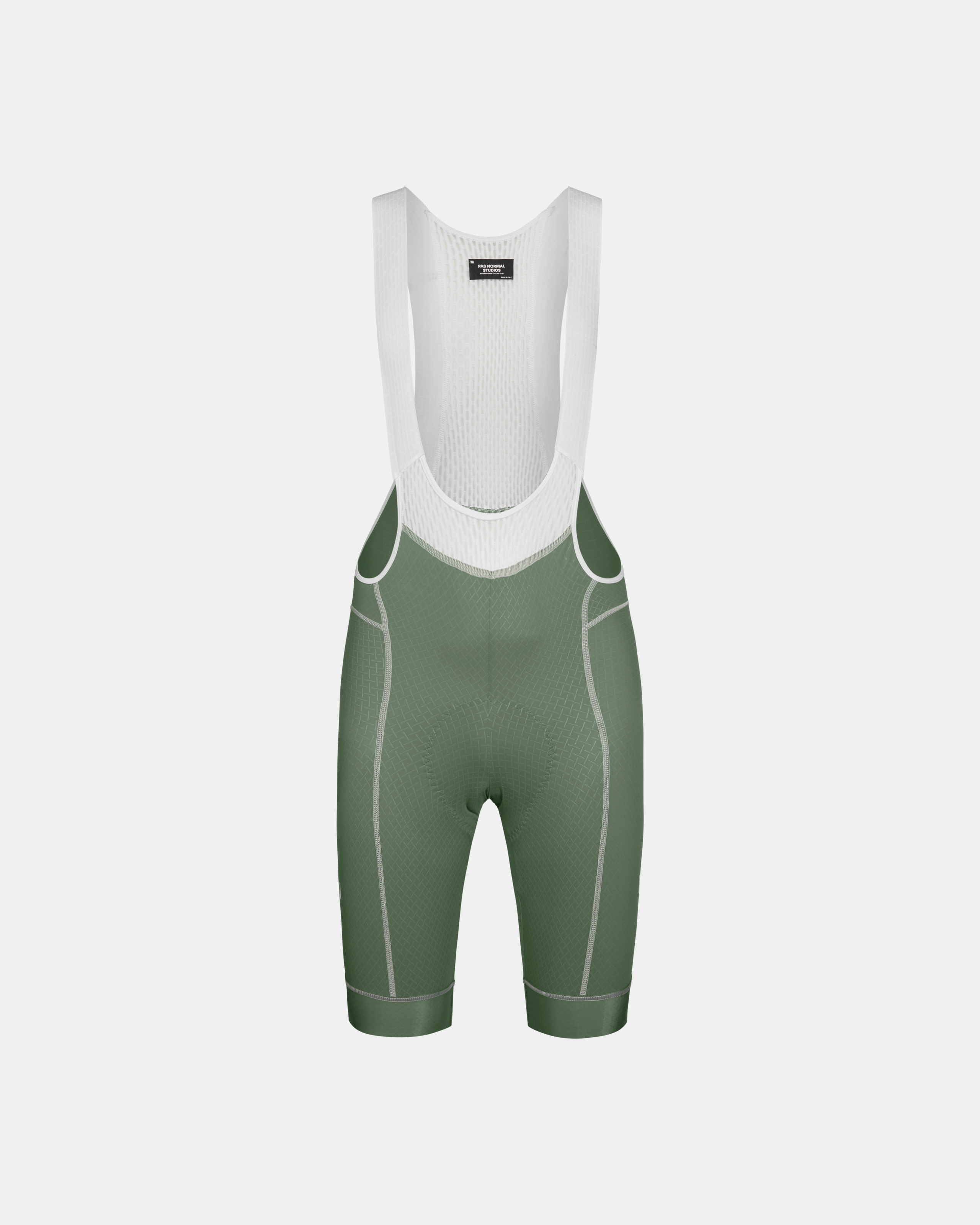 Khaki Green Mechanism cycling bibs, front flat lay with white mesh bib and contrast stitching