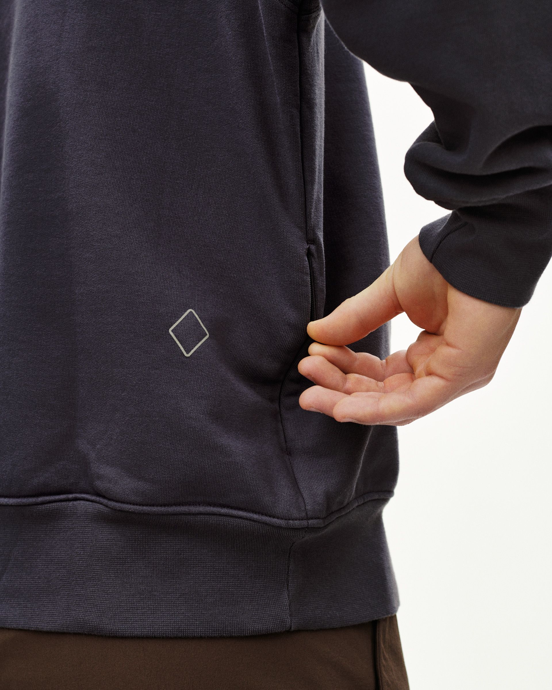 Grey Off-Race sweatshirt on model showing side view with diamond logo detail