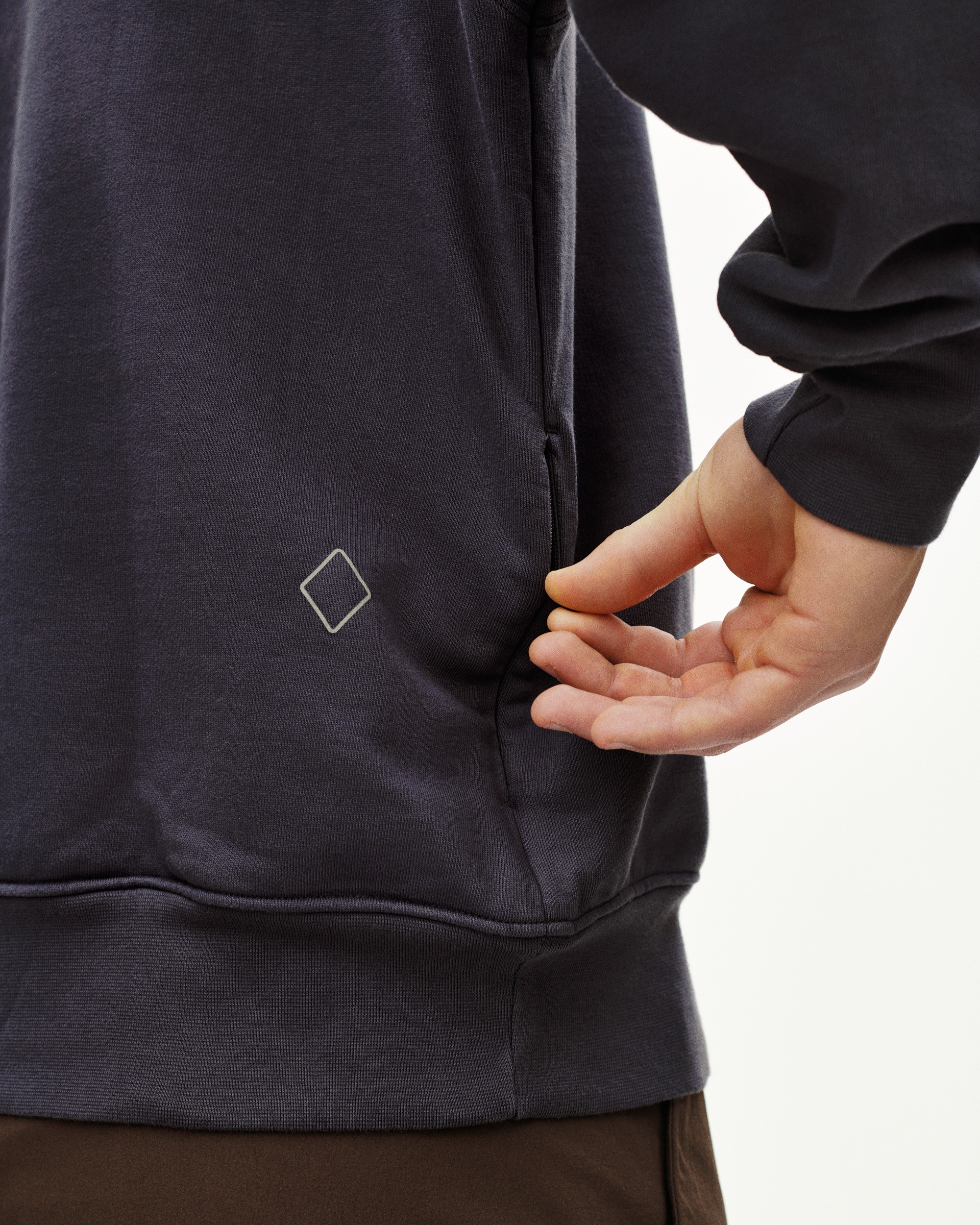 Grey Off-Race sweatshirt on model showing side view with diamond logo detail