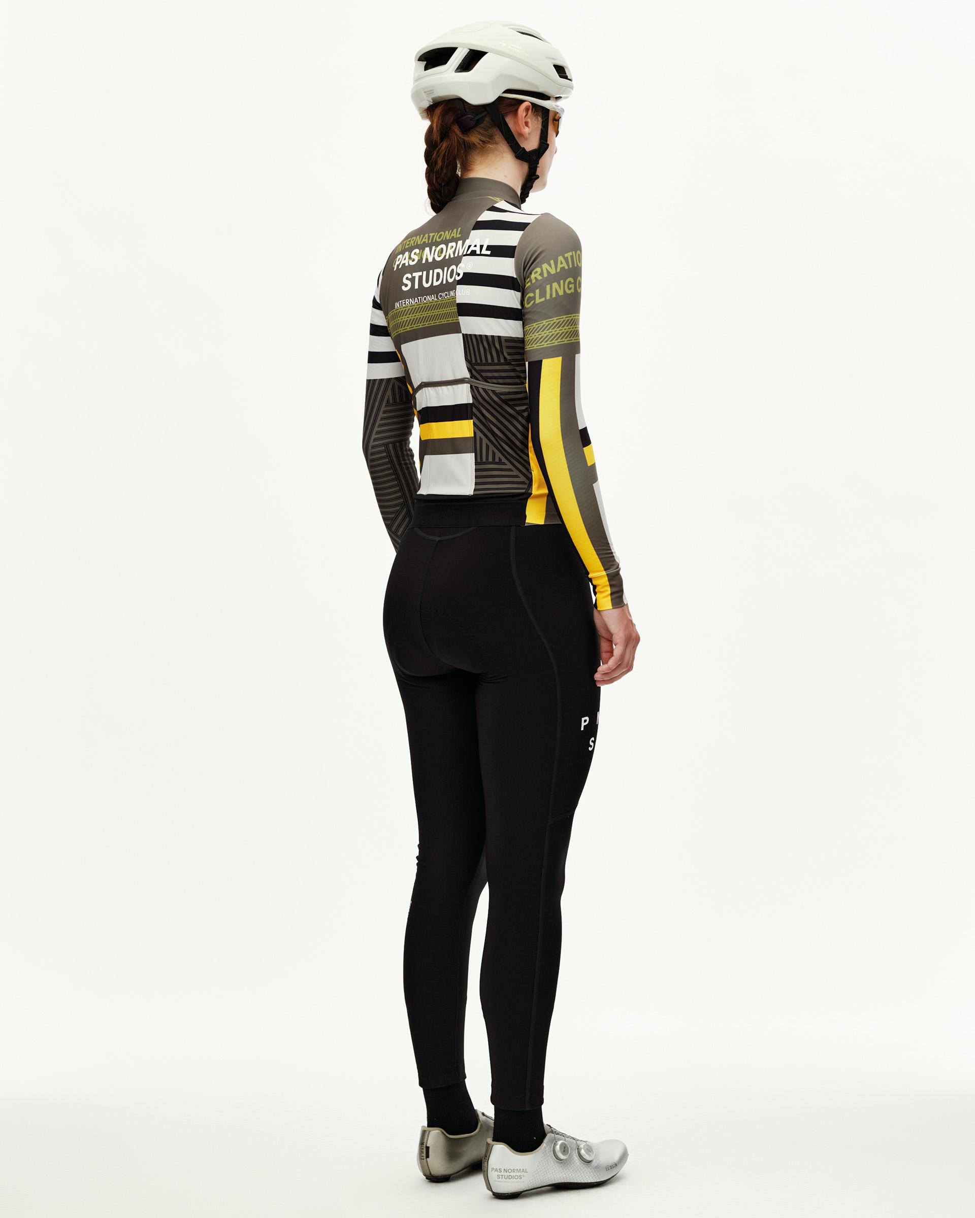 International Sand Mechanism women's long sleeve cycling jersey on model, rear view with graphic stripe print