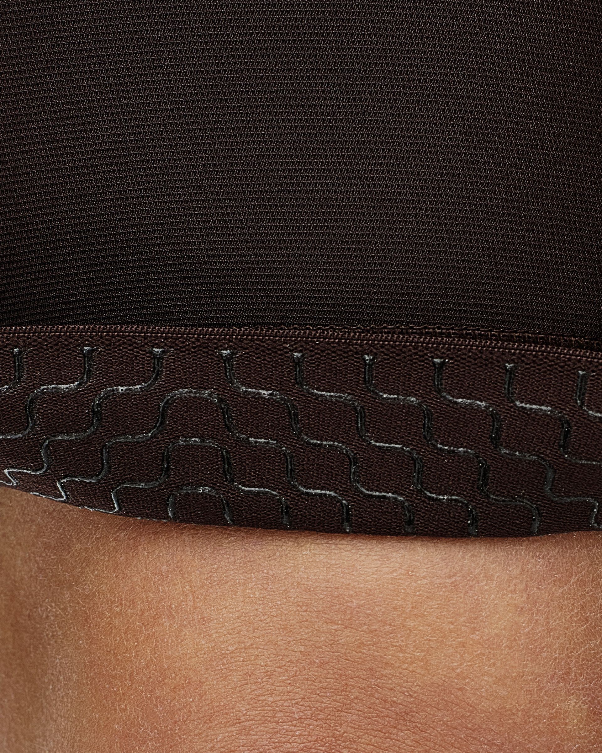 Silicone gripper pattern on garment hem for secure positioning during rides