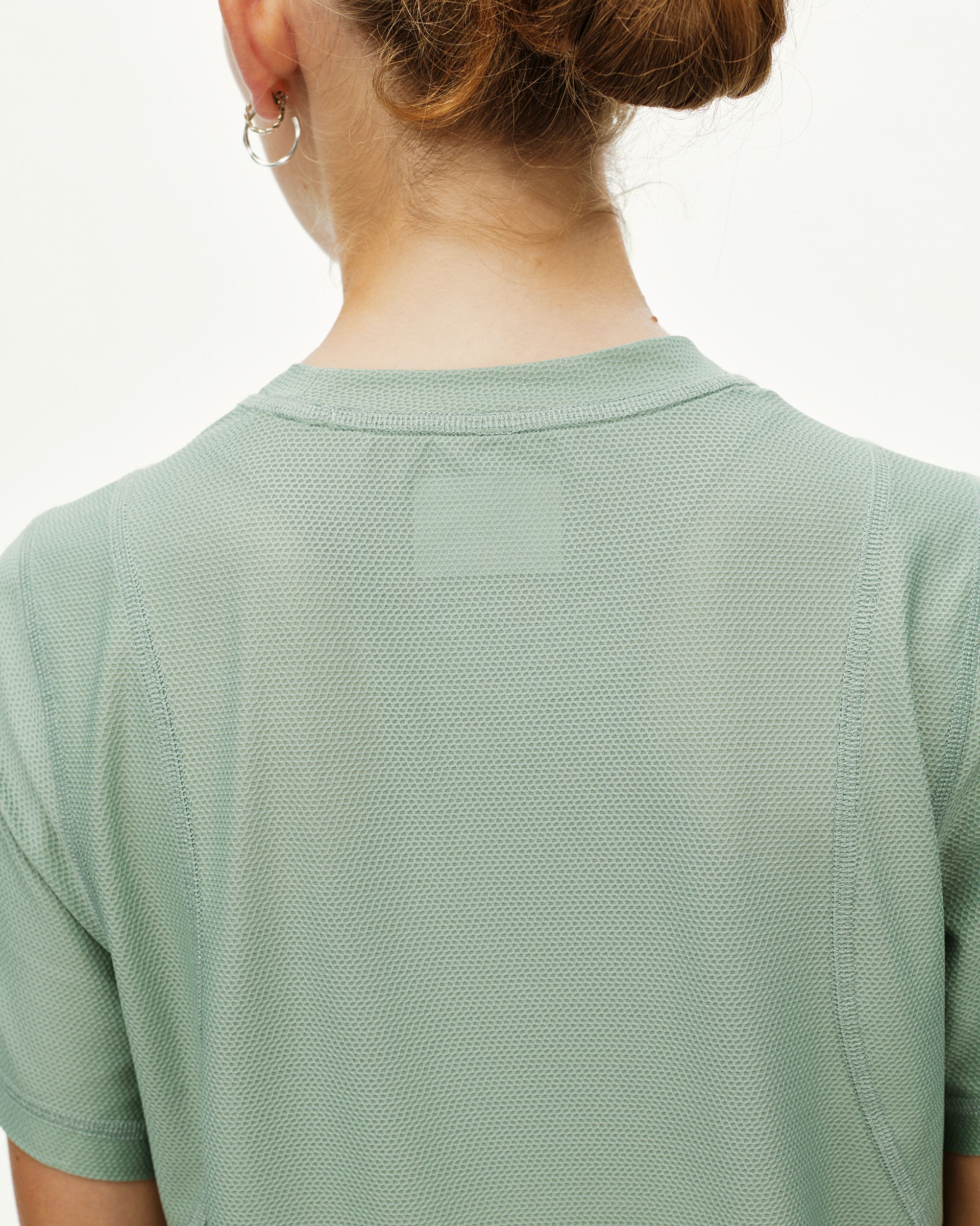 Green Sage Balance women's T-shirt, rear view on model with textured mesh fabric