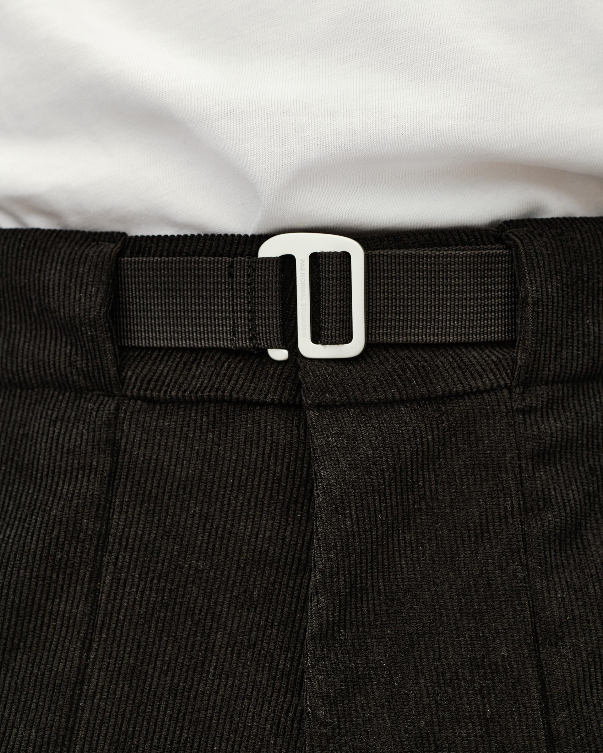 Black Off-Race Corduroy pants, detail view of white buckle clasp on webbing waistband