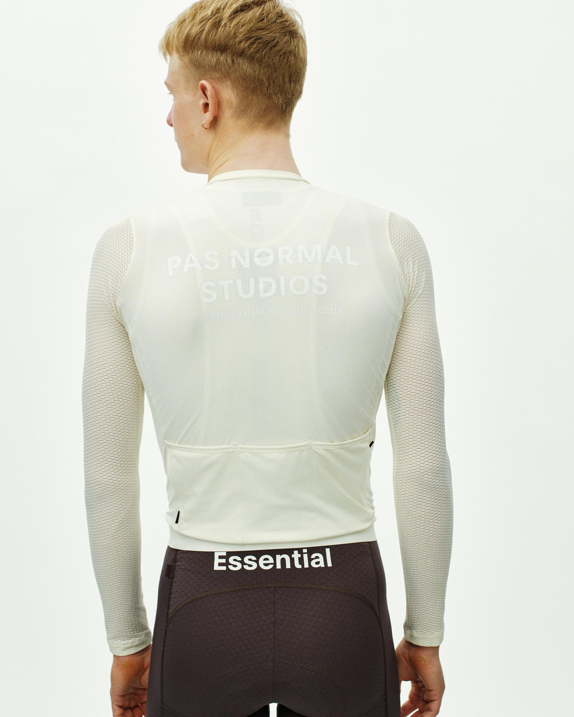Off White Essential Light long sleeve cycling jersey, rear view on model with mesh sleeves