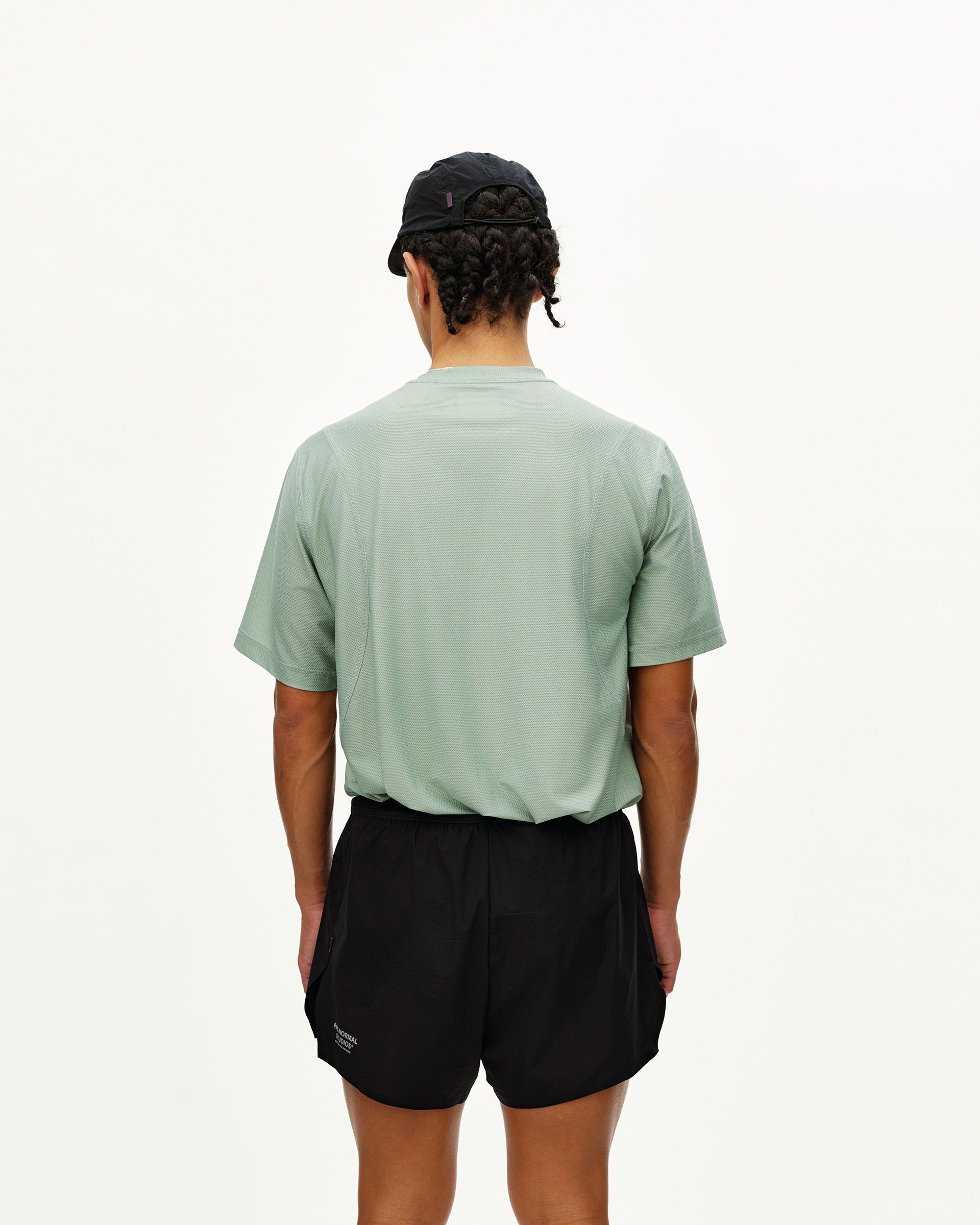 Black Balance 2-in-1 shorts on model, rear view with elastic waistband and textured top layer