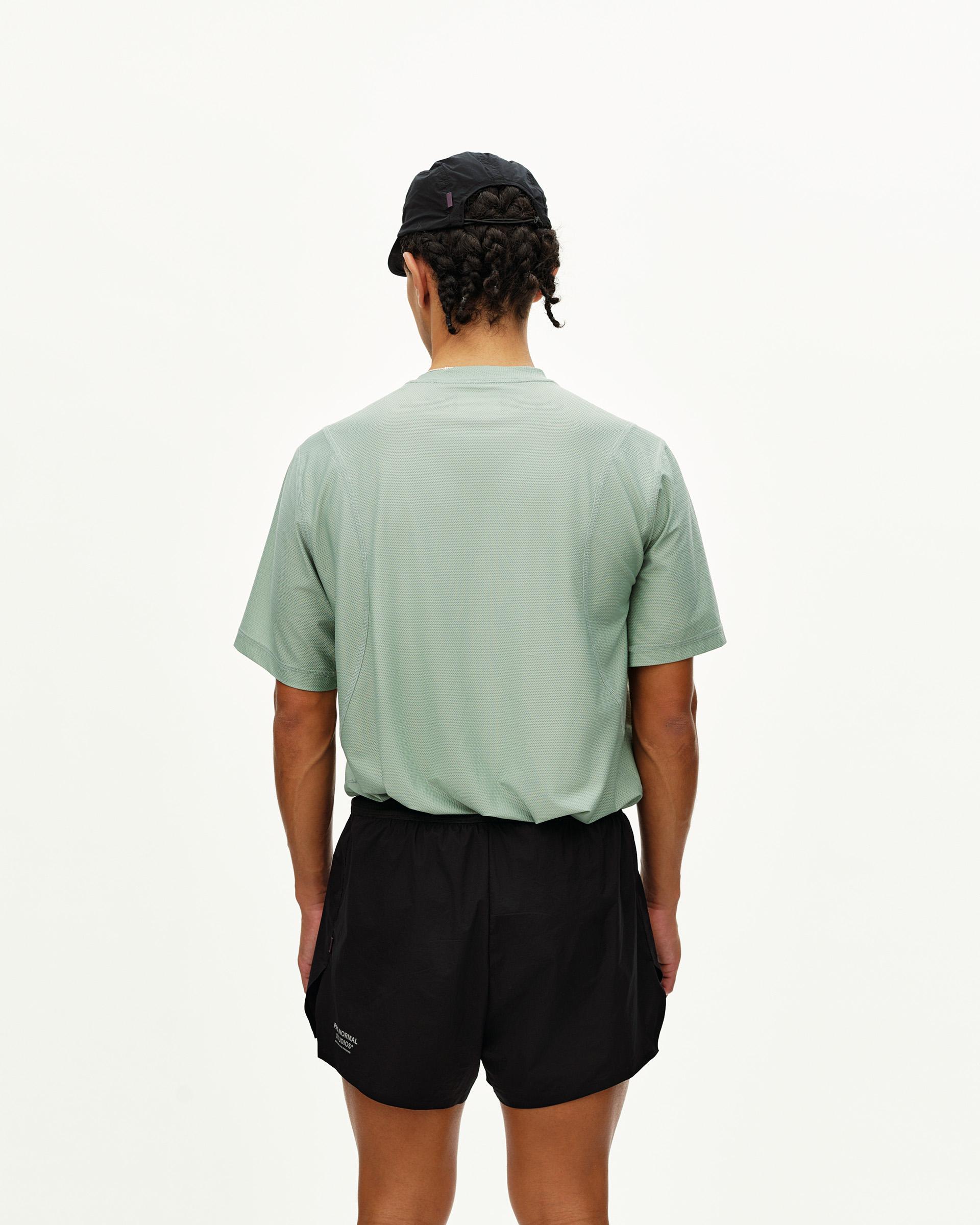 Black Balance 2-in-1 shorts on model, rear view with elastic waistband and textured top layer
