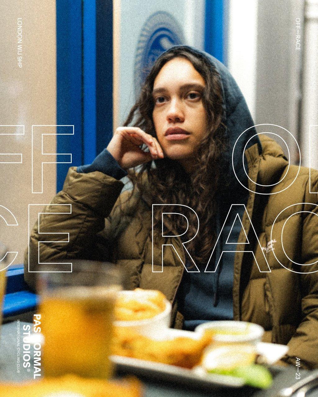Model wearing olive green Off-Race jacket in casual cafe setting