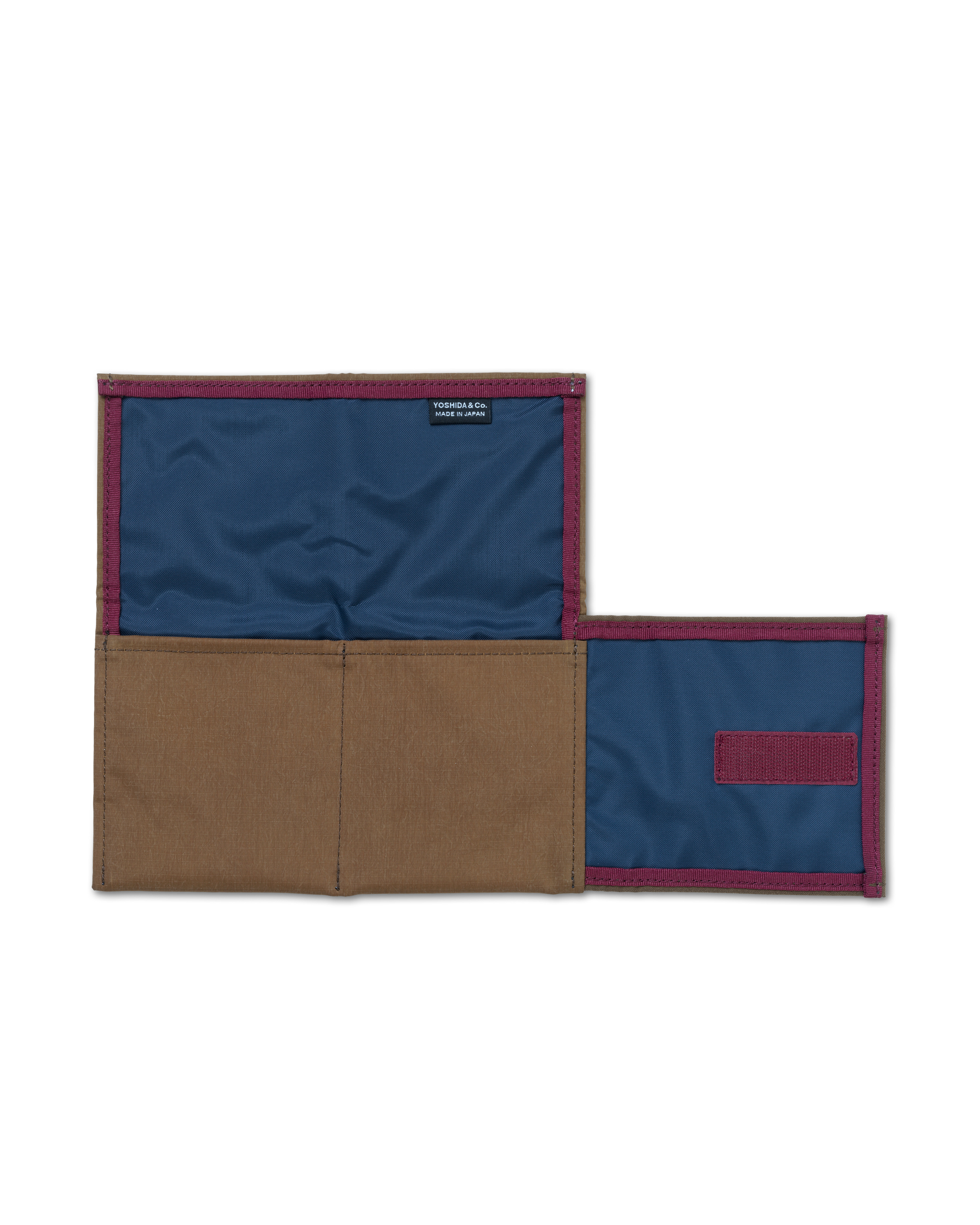 Light Brown Porter-Yoshida saddle bag opened flat showing navy blue interior lining and burgundy trim with Yoshida & Co