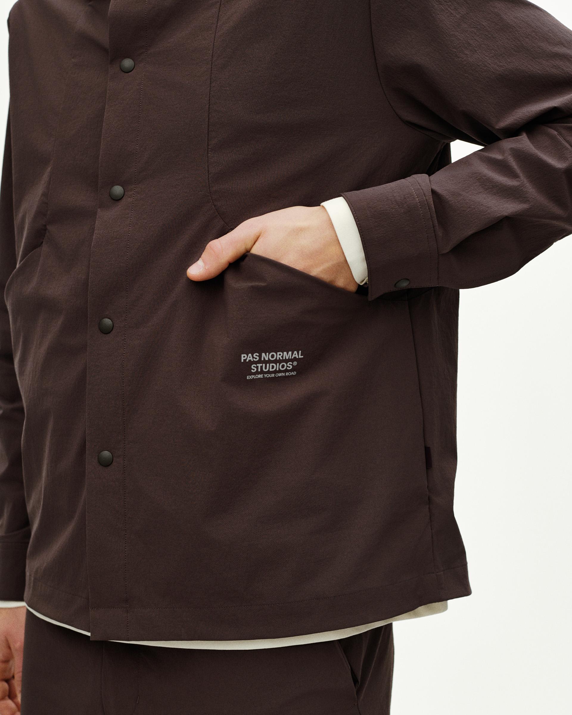 Dark Purple Off-Race Tech Overshirt on model showing snap button closure and chest logo