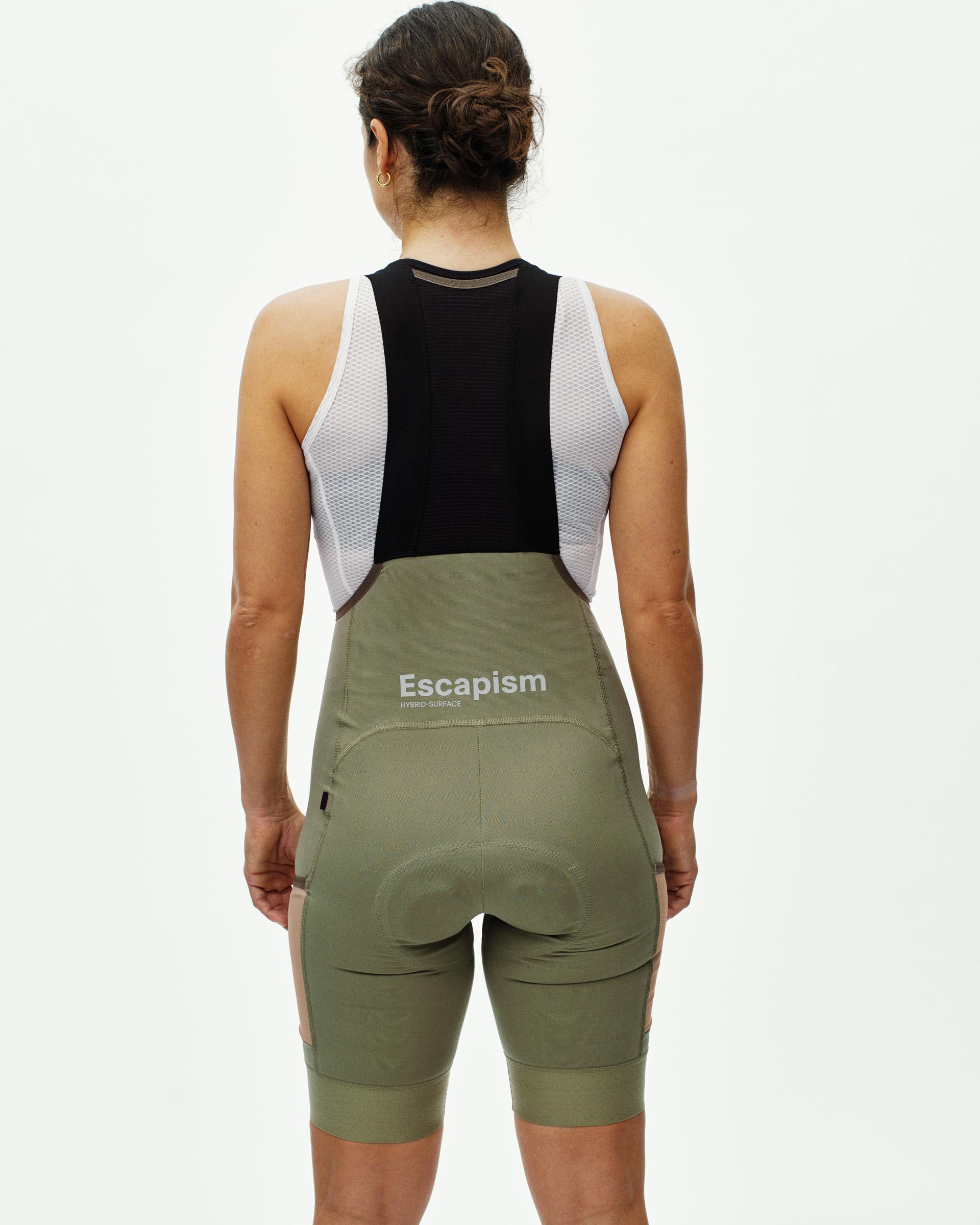 Light Olive Escapism Cargo bibs on model, rear view with white mesh back panel and Escapism waistband print
