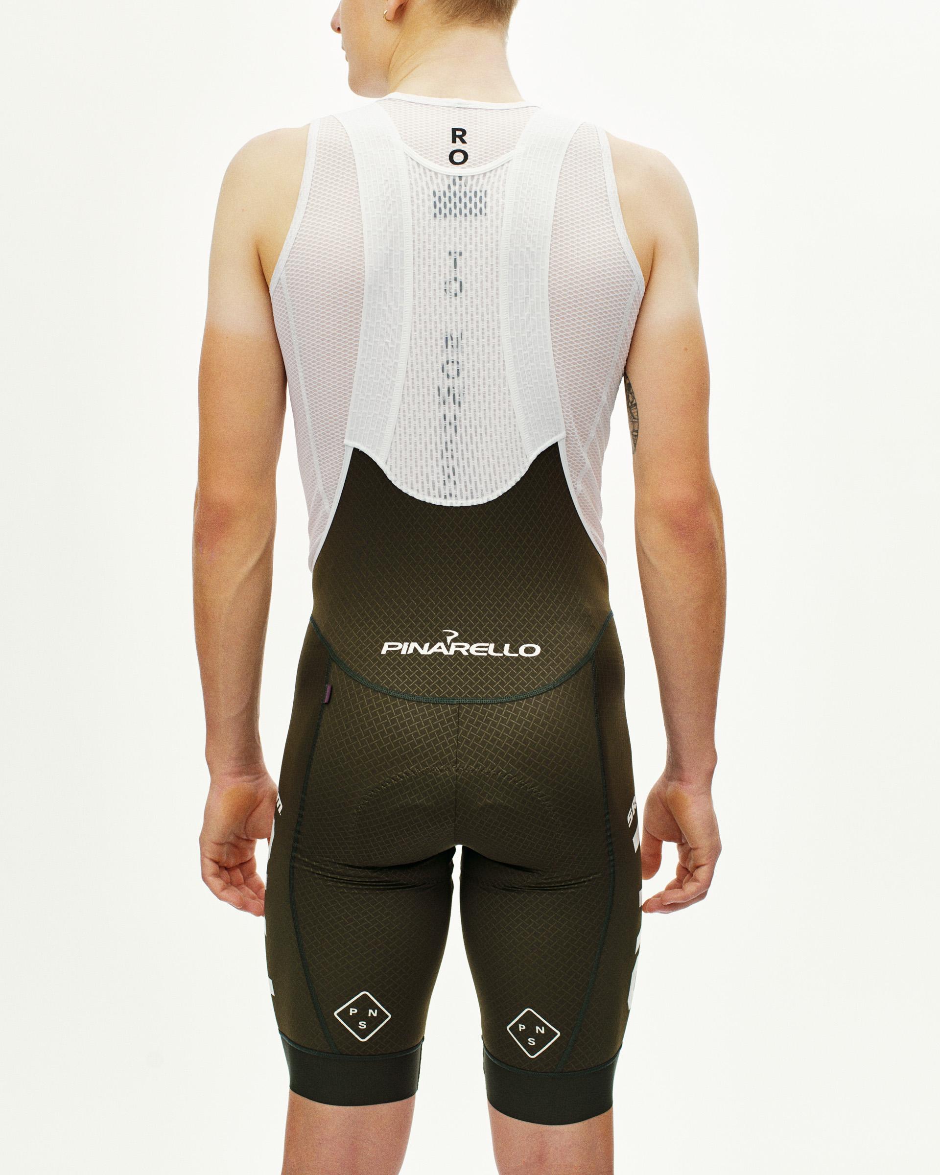 Dark Olive STFR Mechanism bibs, rear view on model with white mesh back panel and Pinarello branding