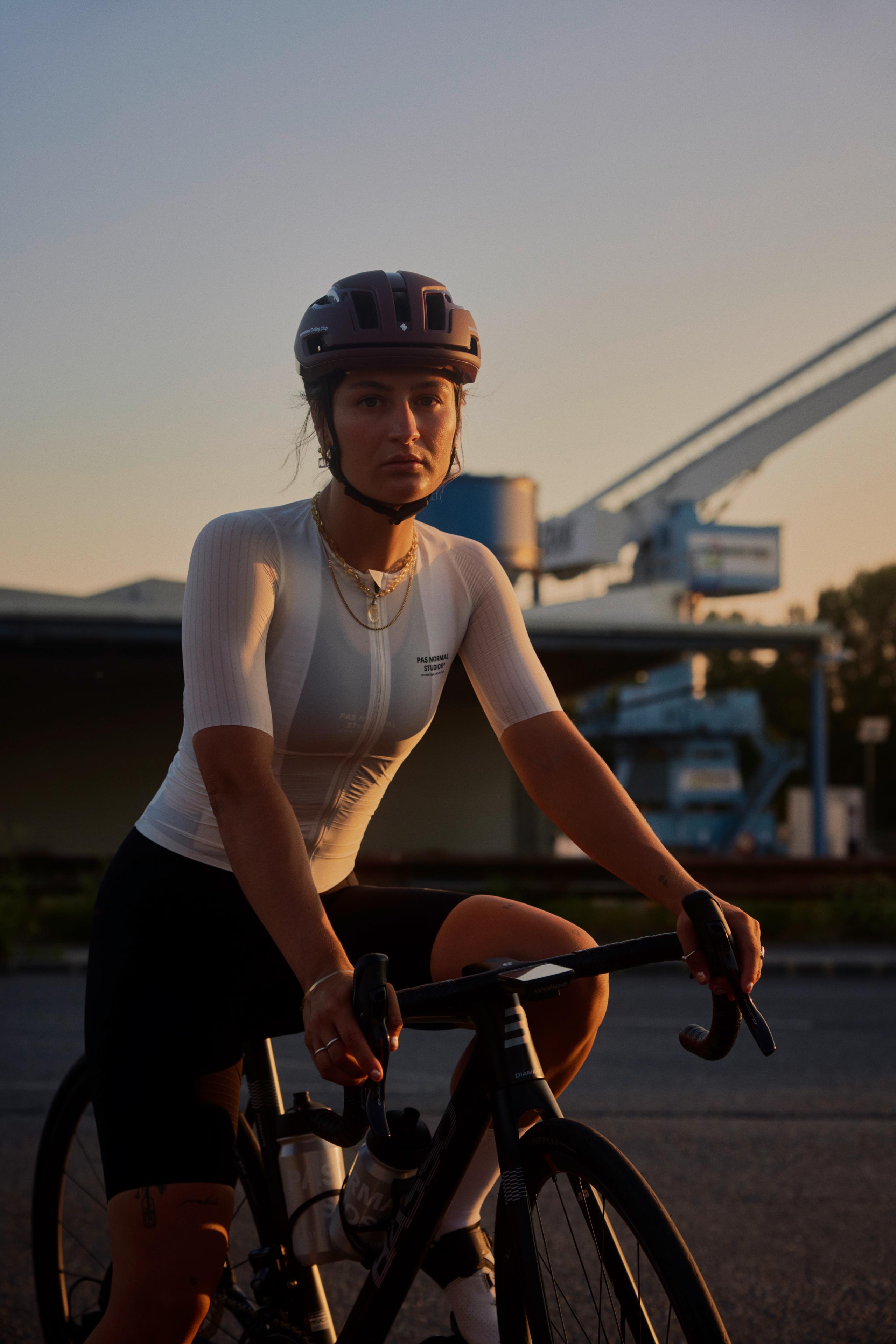 Off White Mechanism Pro cycling jersey on model with ribbed sleeves and zip front
