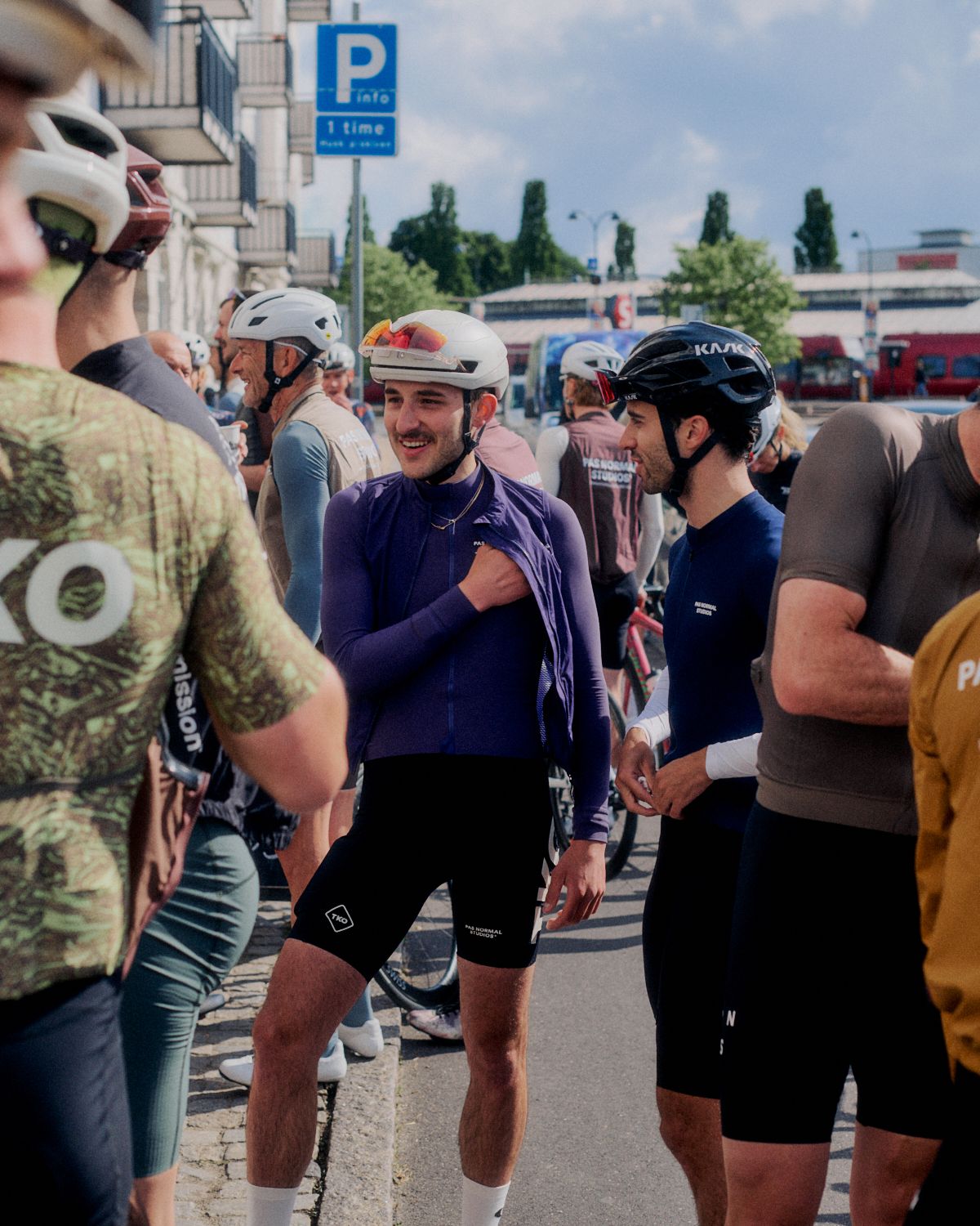 Cyclists gathering at Brand Summit 2024 event wearing purple and navy cycling apparel