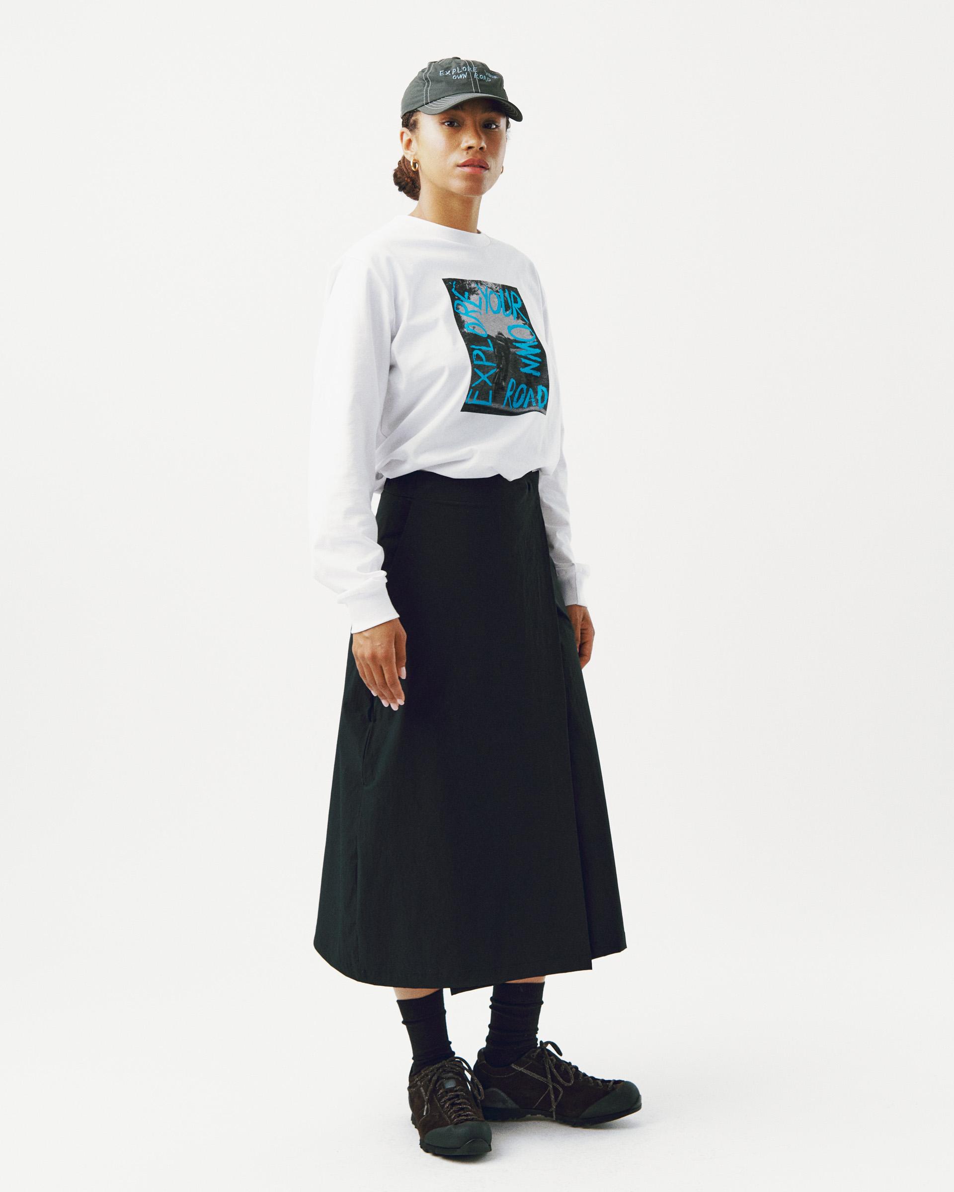 White Off-Race Graphic long sleeve t-shirt on model with blue graphic chest print