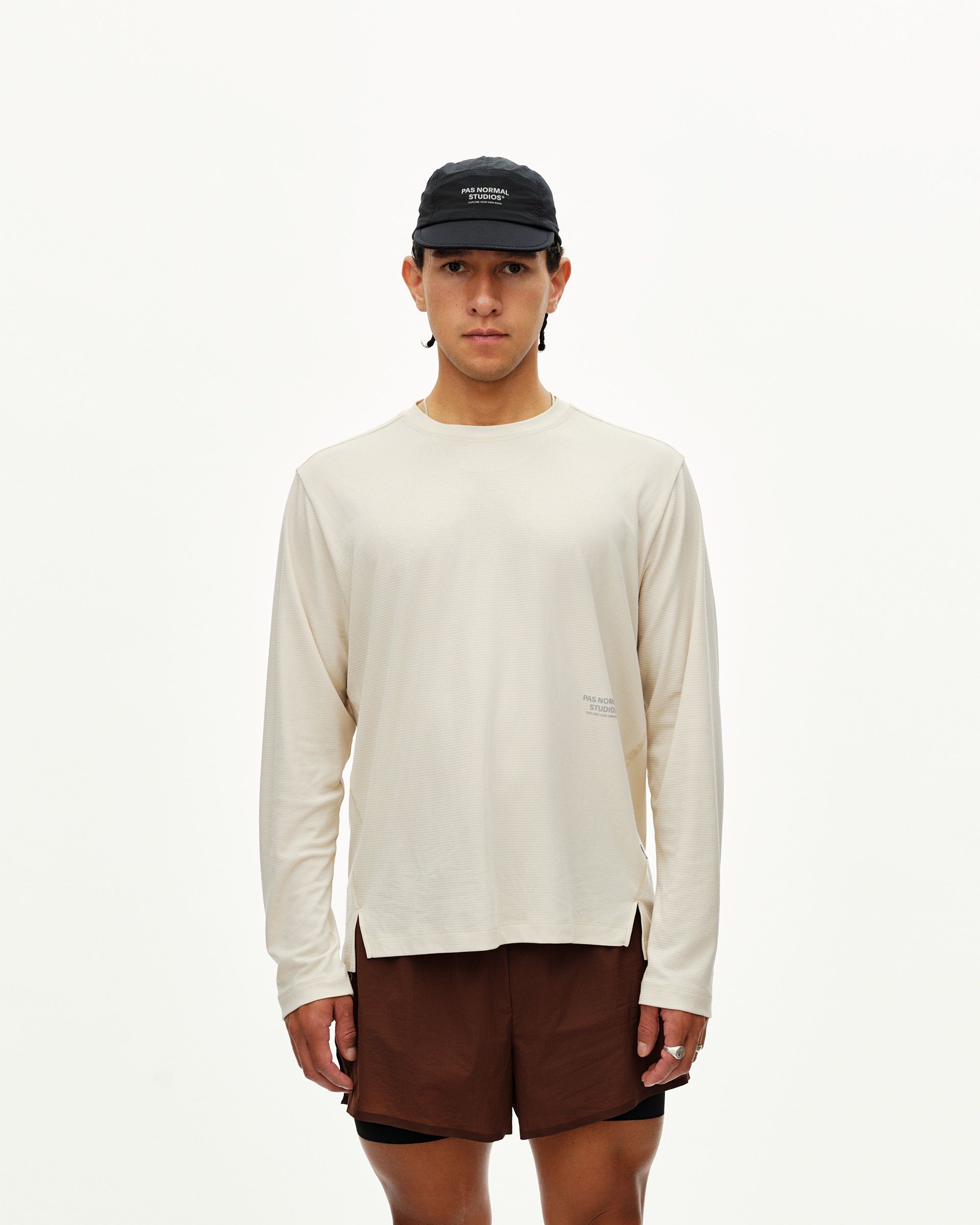 Sand Balance long sleeve T-shirt on model, front view with tonal chest logo print