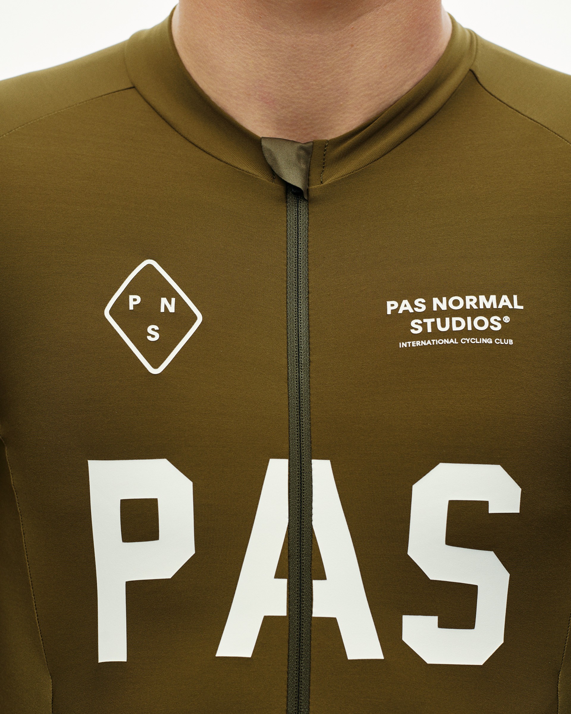 Moss Brown PAS Thermal cycling speedsuit, front detail on model with large white chest print