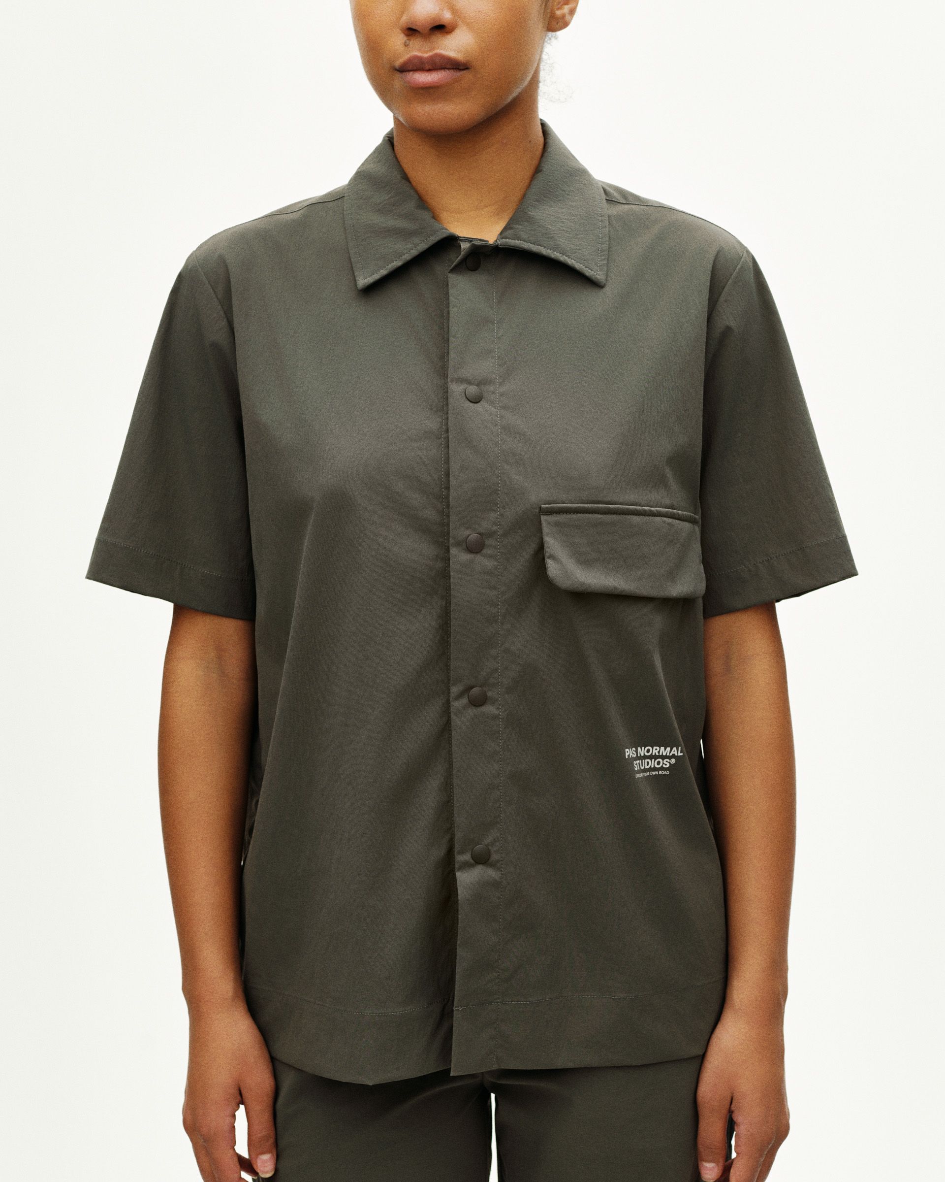 Dark Grey Off-Race Light Tech shirt on model, front view with chest pocket and button placket