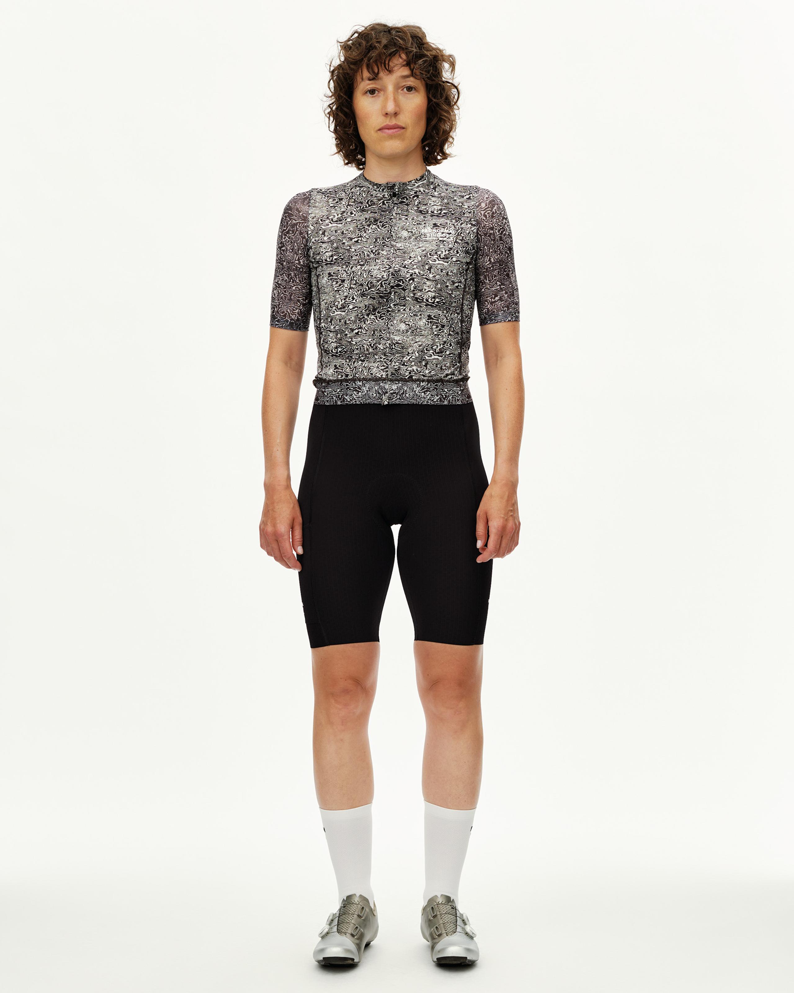 Off White Essential cycling jersey on model, front view with black and white swirl all-over print