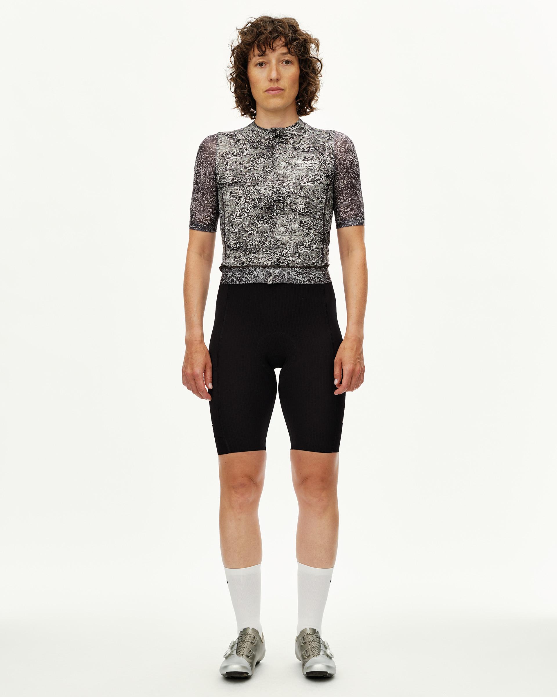 Off White Essential cycling jersey on model, front view with black and white swirl all-over print