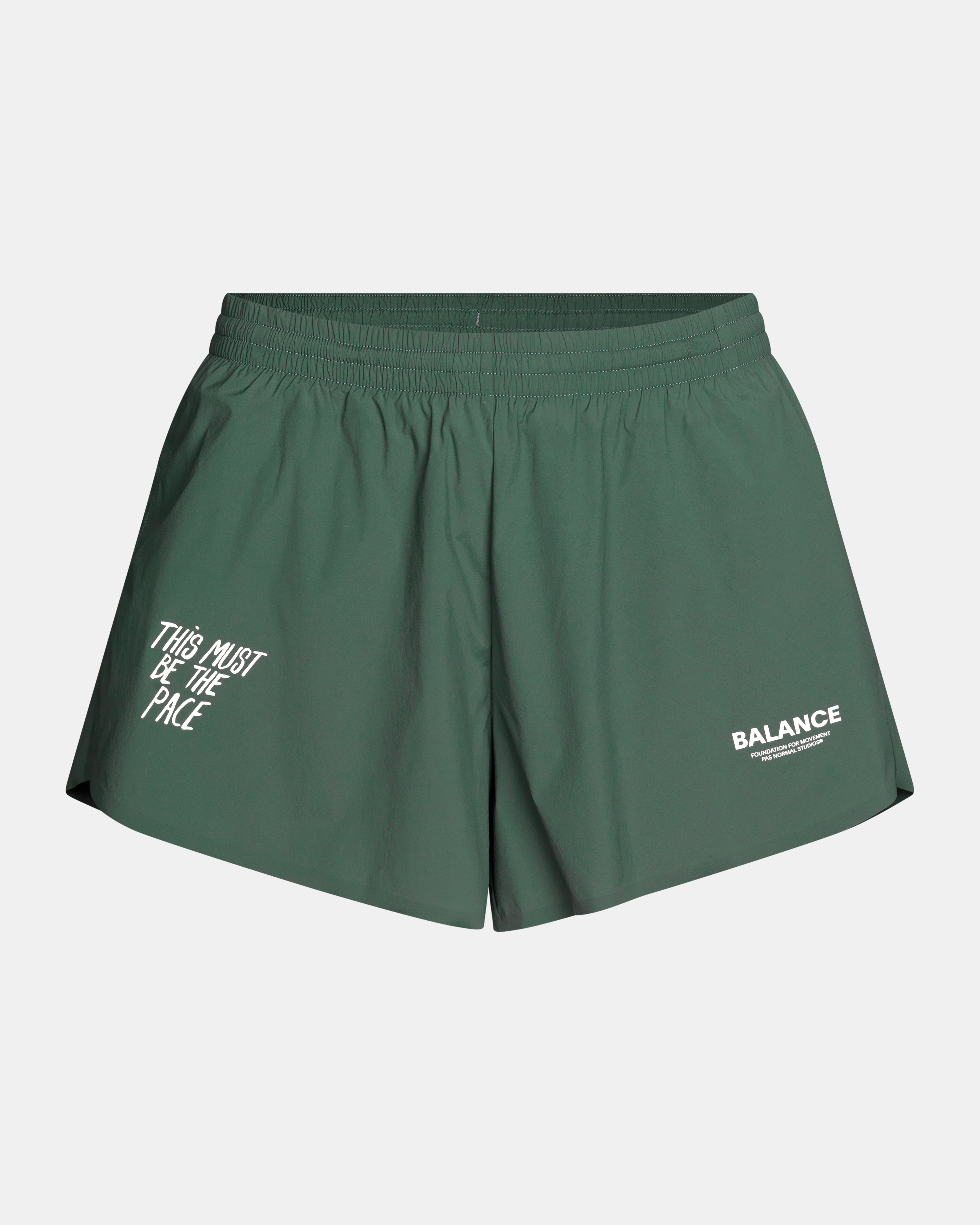 Forest Green Balance shorts, front flat lay with white slogan and logo prints