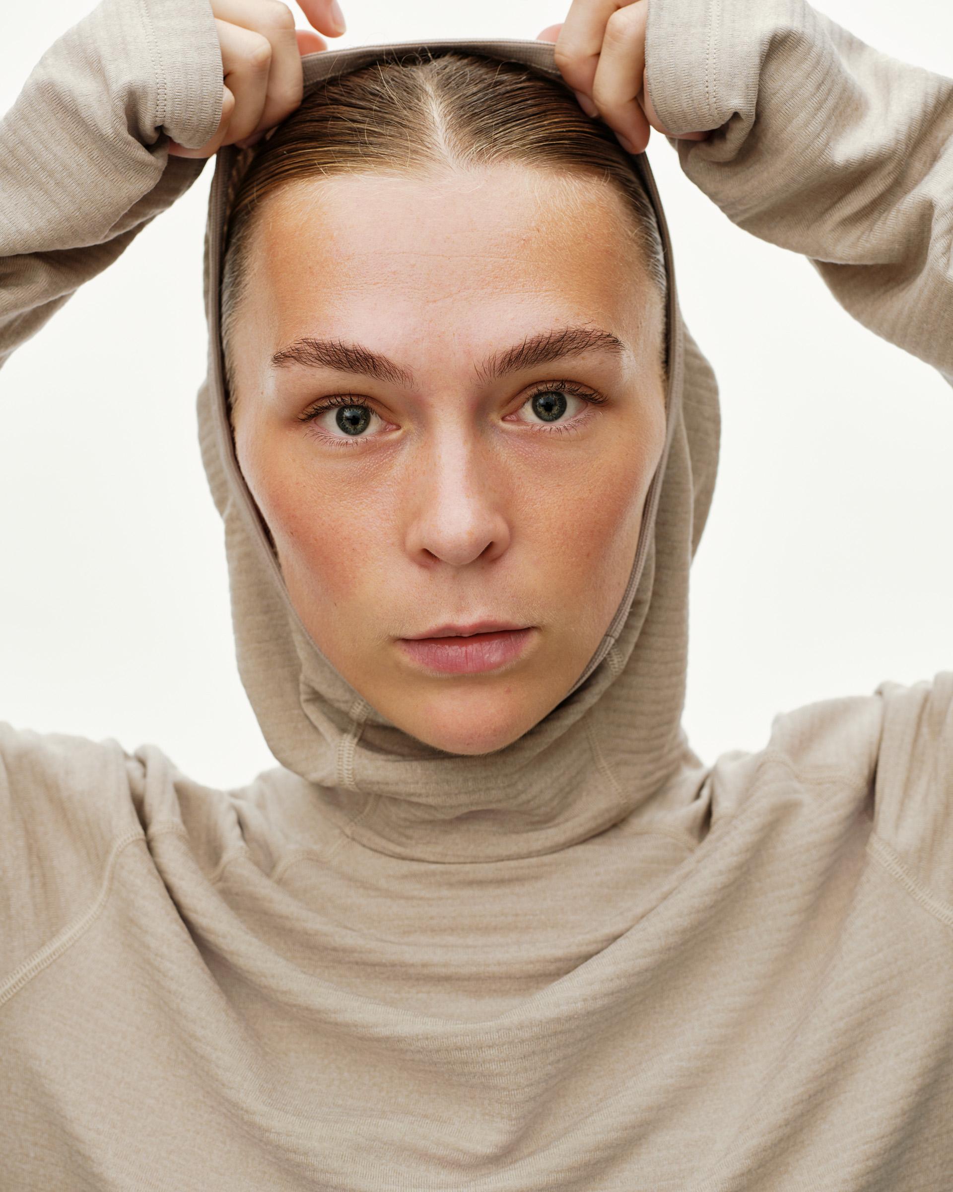 Haze purple Balance Thermal hoodie on model, front close-up with hood pulled over head