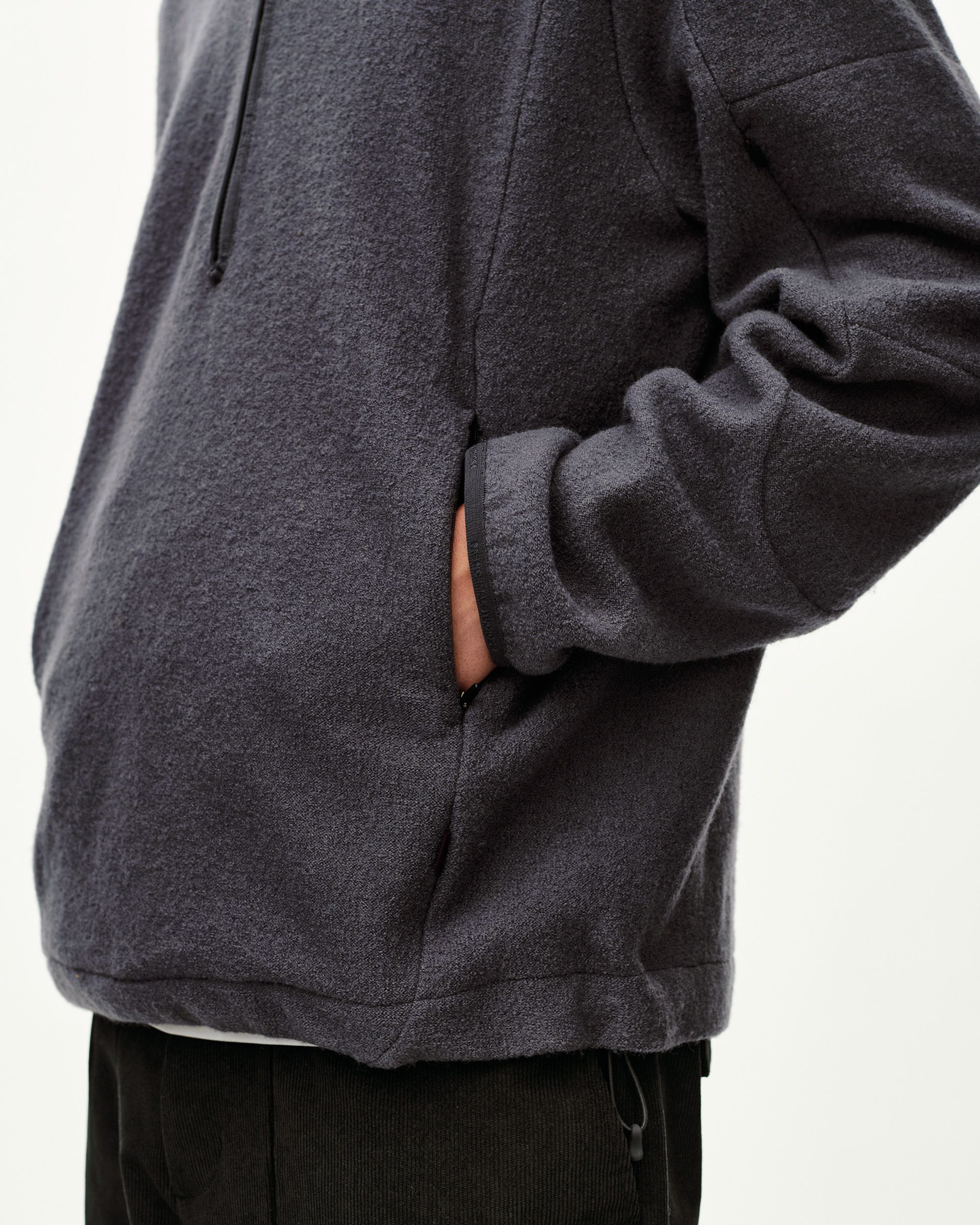 Steel grey Off-Race Boiled Wool Half-Zip outerwear, side detail on model showing slash pocket