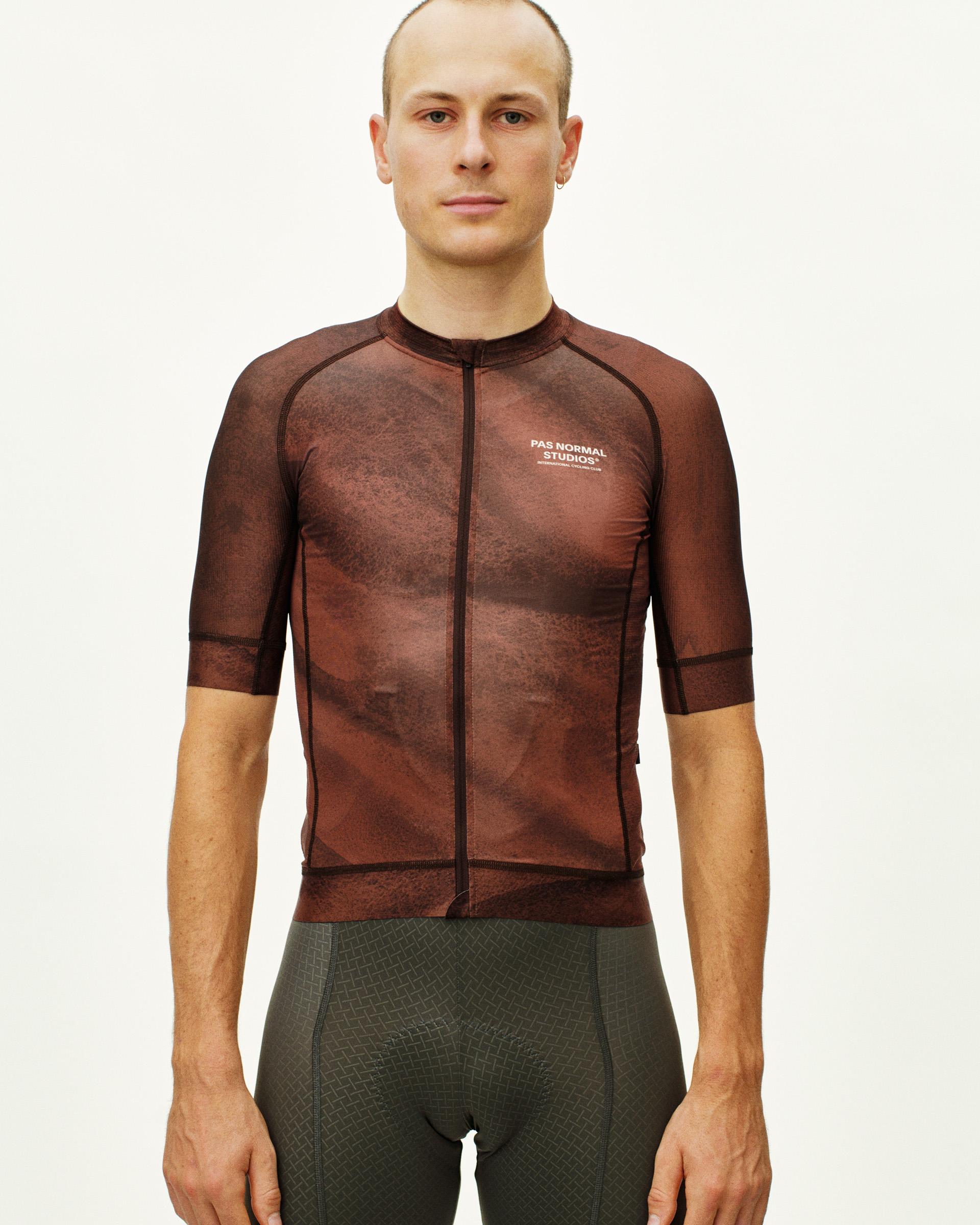 Brown Mechanism cycling jersey on model, front view with textured print