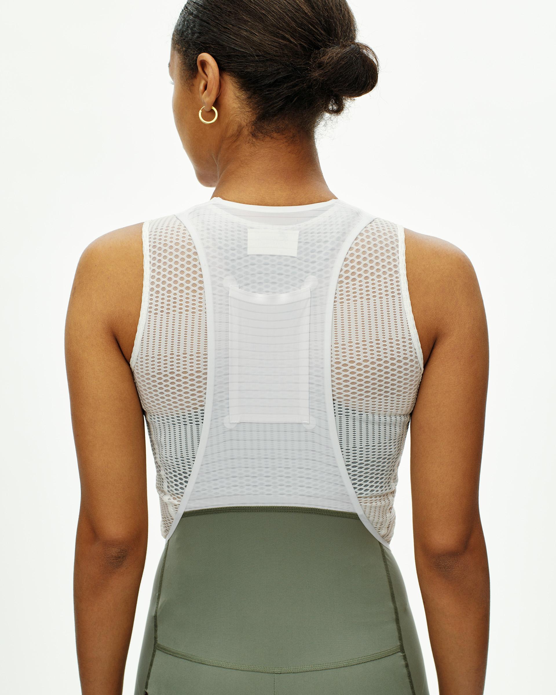 Grey PAS Mechanism Pro bibs on model, rear view with white mesh panel construction
