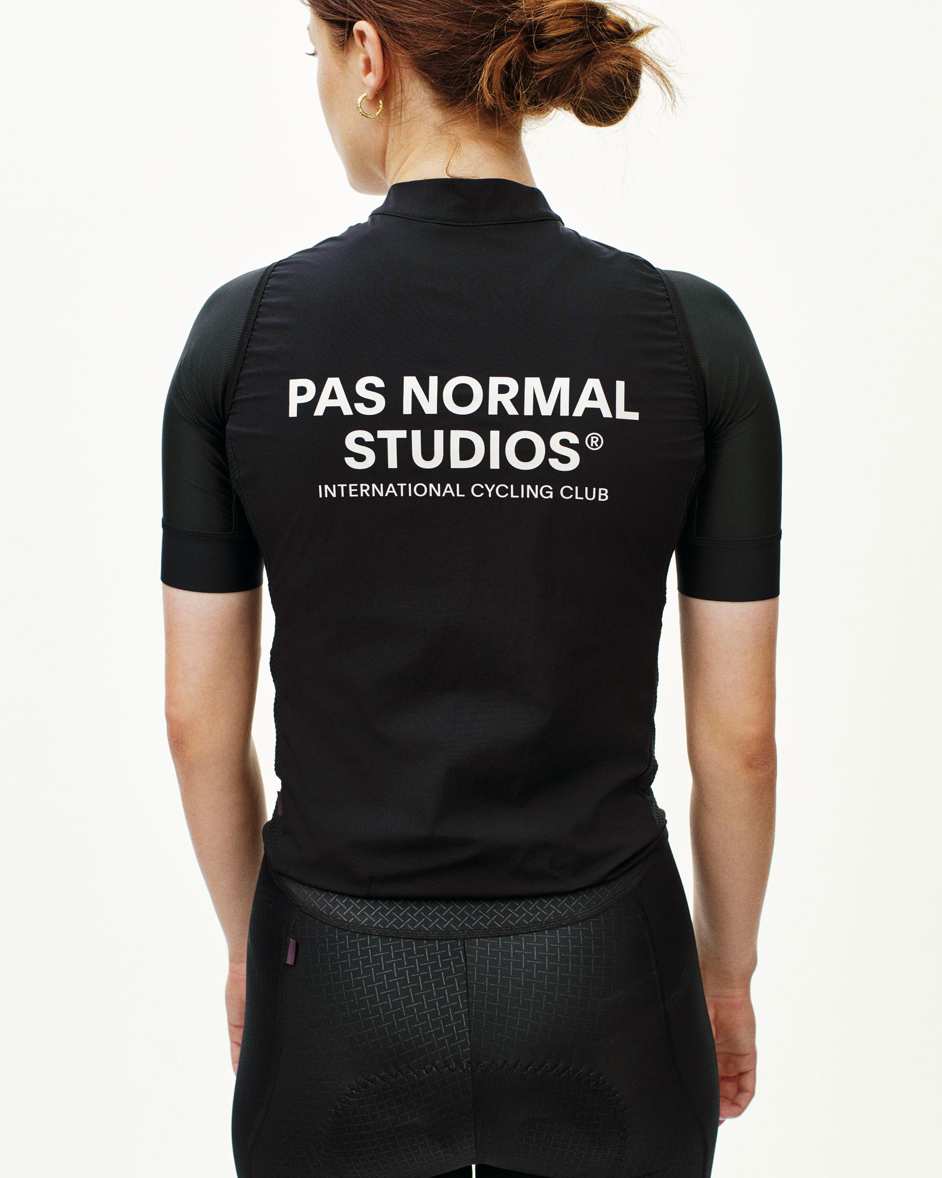 Black Mechanism Stow Away gilet on model, rear view with white brand text