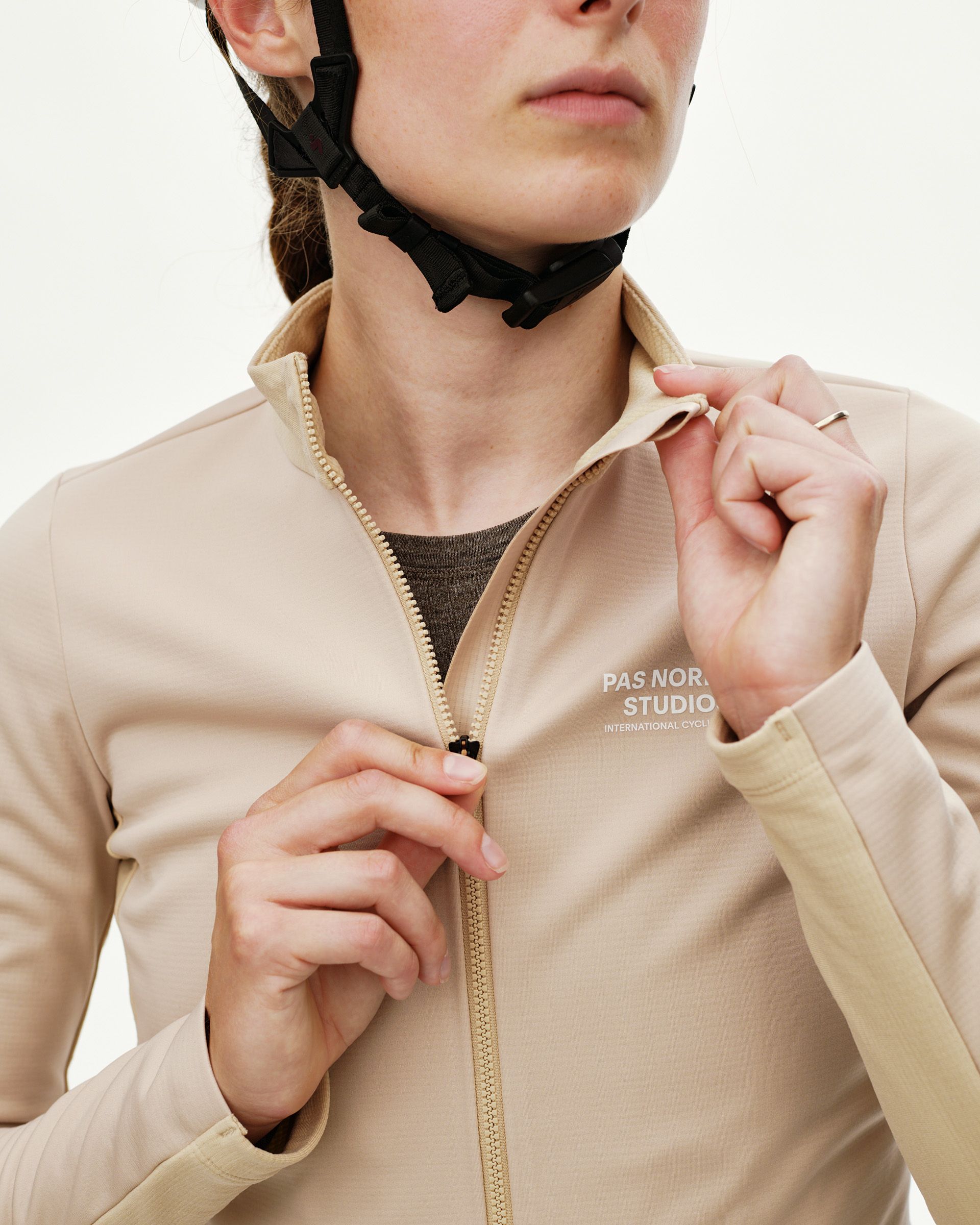 Linen Mechanism Thermal Long Sleeve cycling jersey on model, front detail view with tonal zip and chest logo print