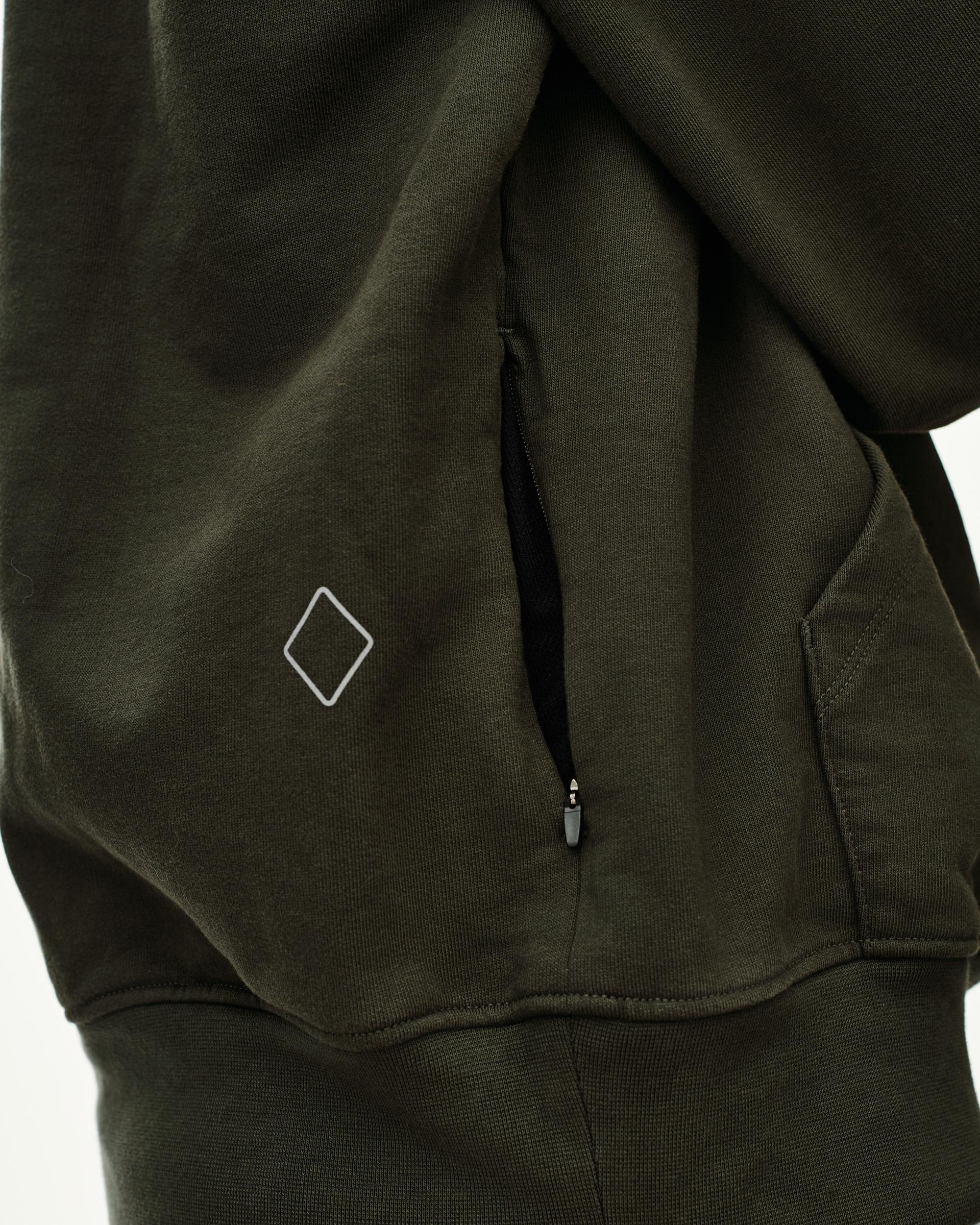 Dark Olive Off-Race hoodie, detail view of side zip pocket and diamond logo patch