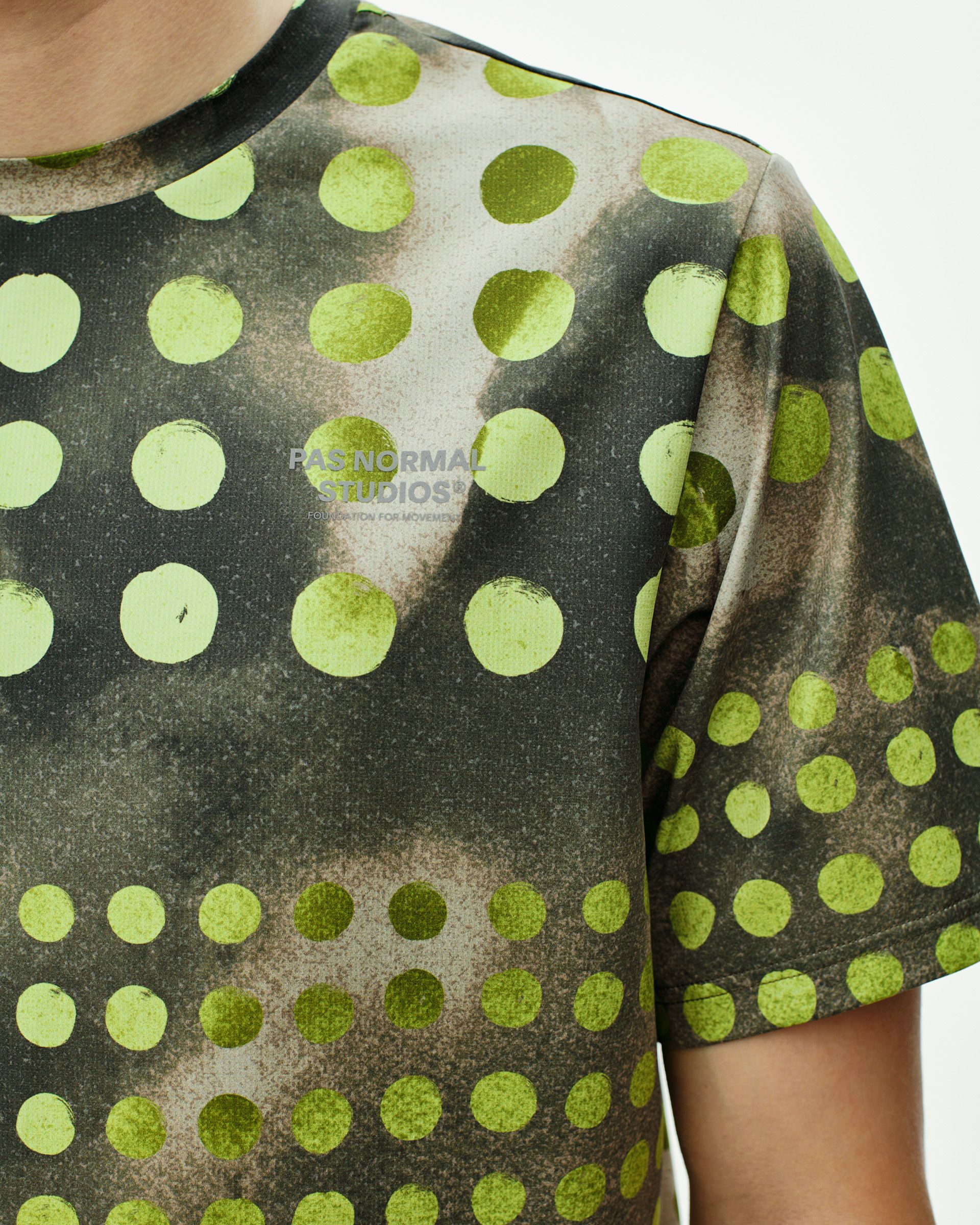 Moss Green T.K.O. Balance t-shirt on model with green polka dot print