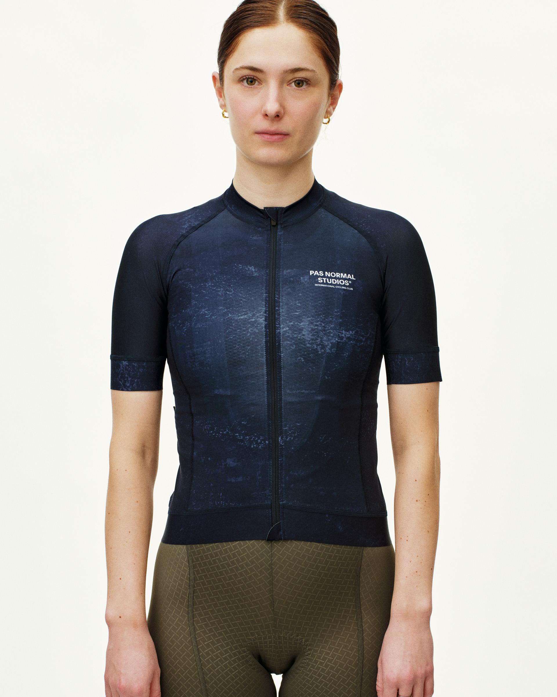 Indigo Mechanism cycling jersey on model with textured print and white chest logo