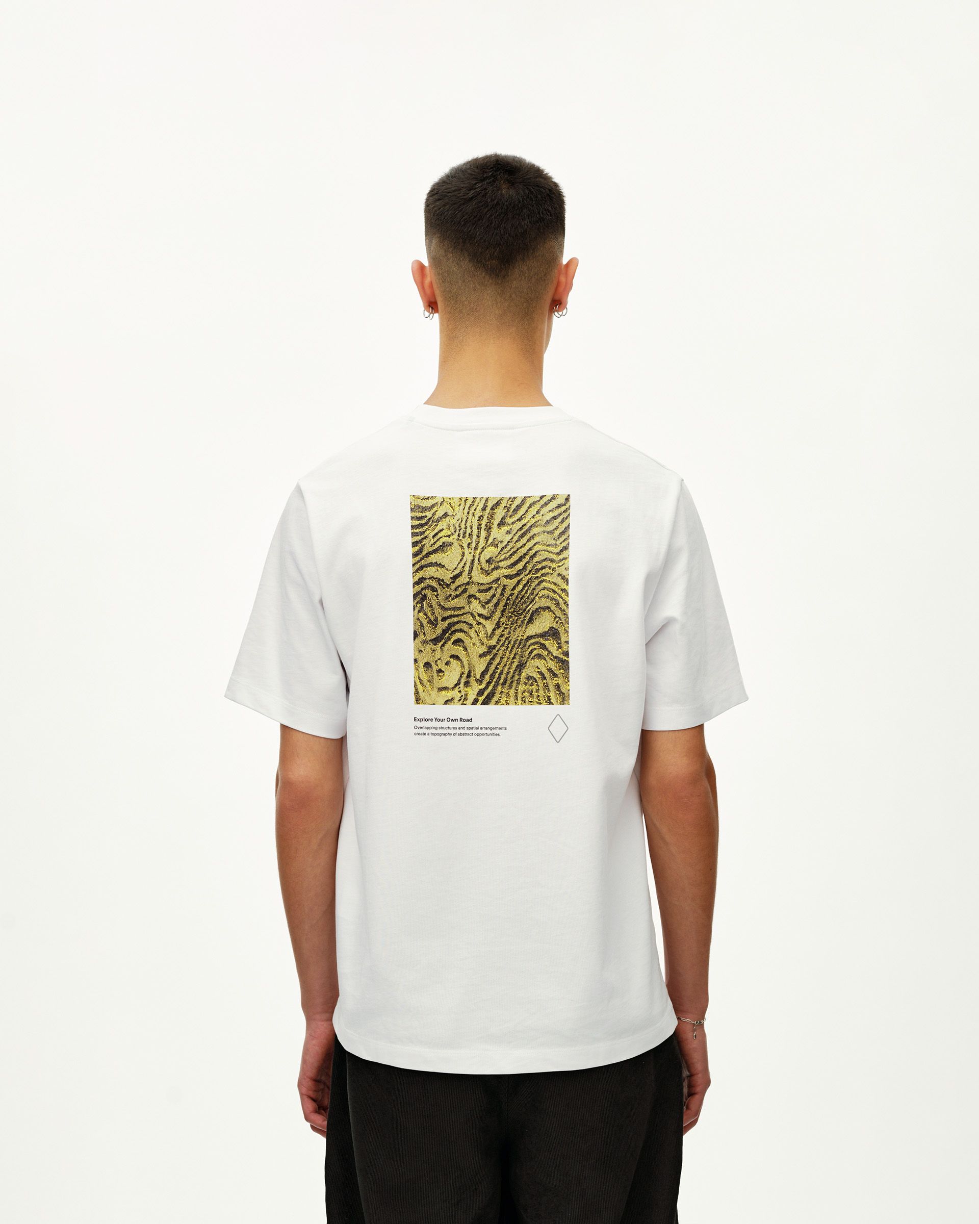 White Off-Race Graphic T-Shirt, rear view on model with abstract yellow topographic back print