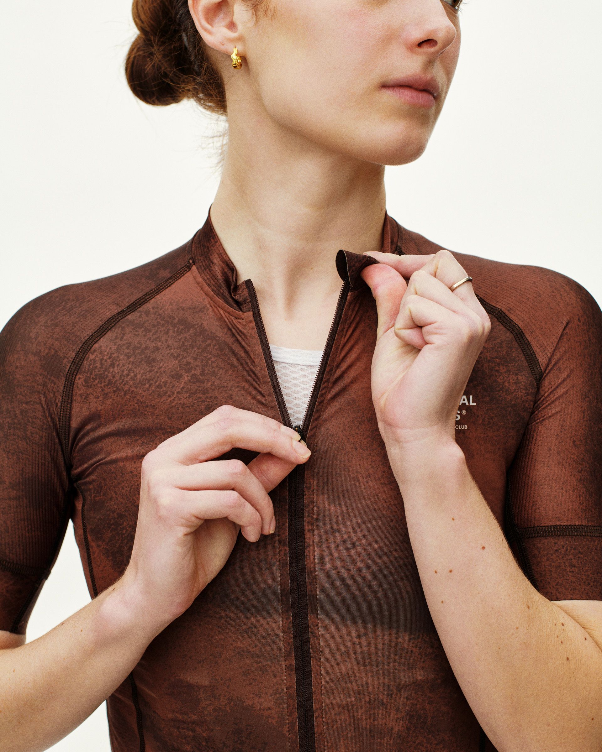 Light Brown Mechanism cycling jersey on model with full zip and contrast seaming