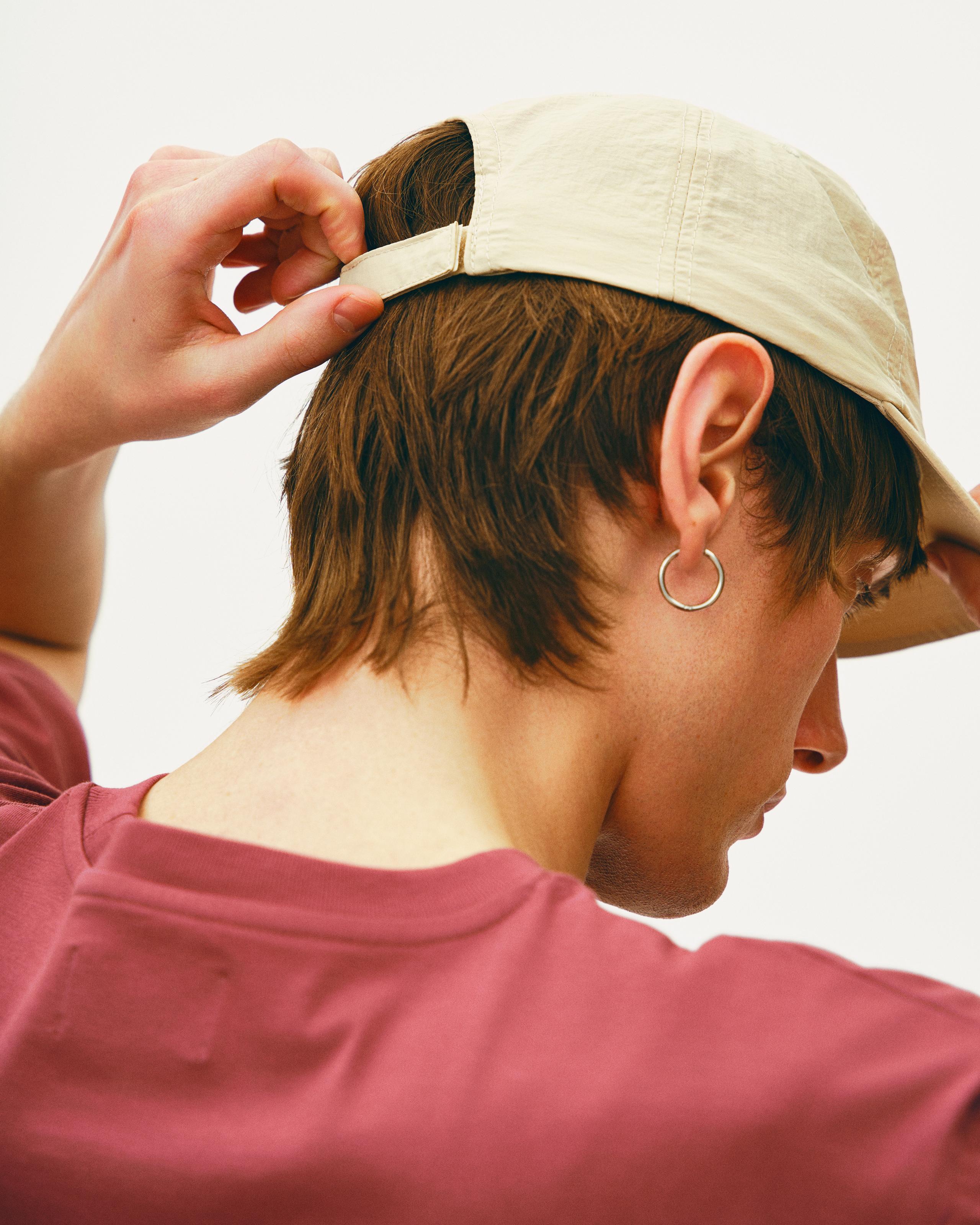 Off White Off-Race cap on model, side view with adjustable strap