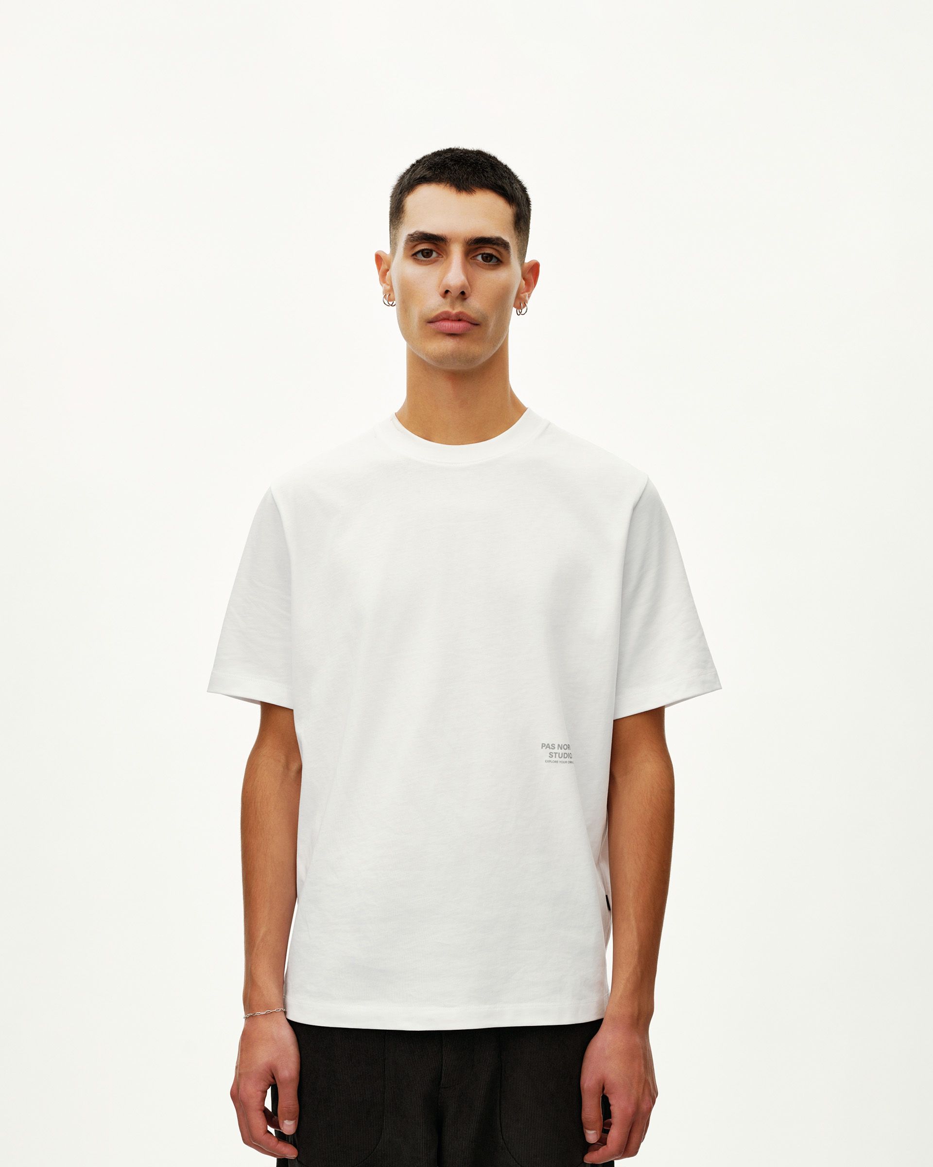 White Off-Race Graphic T-shirt on model, front view with small text print at lower chest