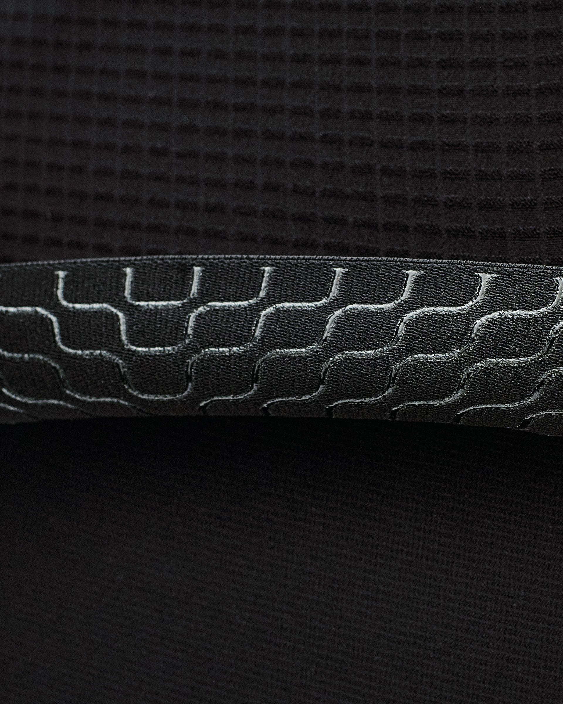 Black Escapism cycling jersey, detail view with contrast stitching pattern