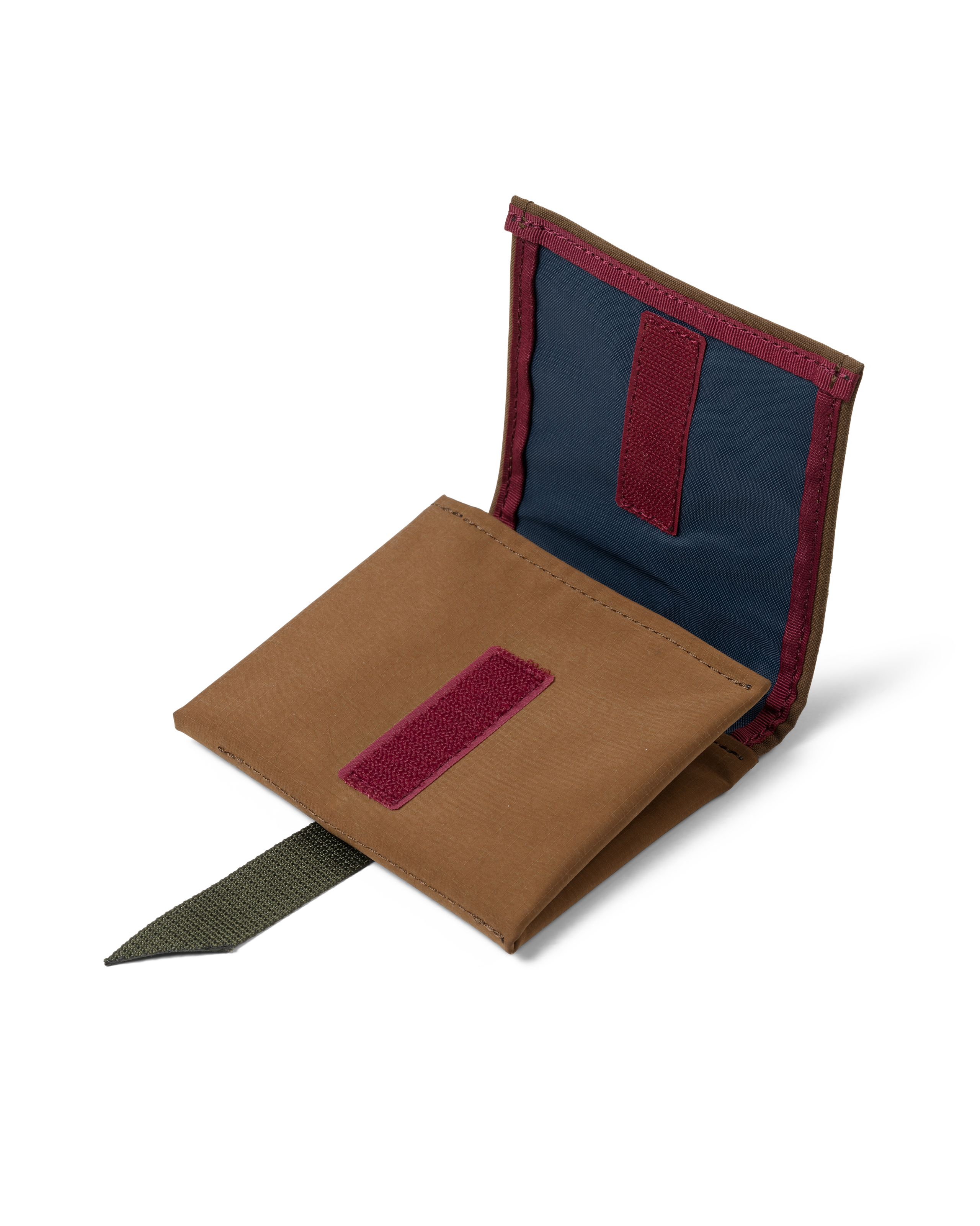 Light Brown Porter-Yoshida saddle bag, opened flat showing navy blue interior with burgundy velcro panels and olive pull tab