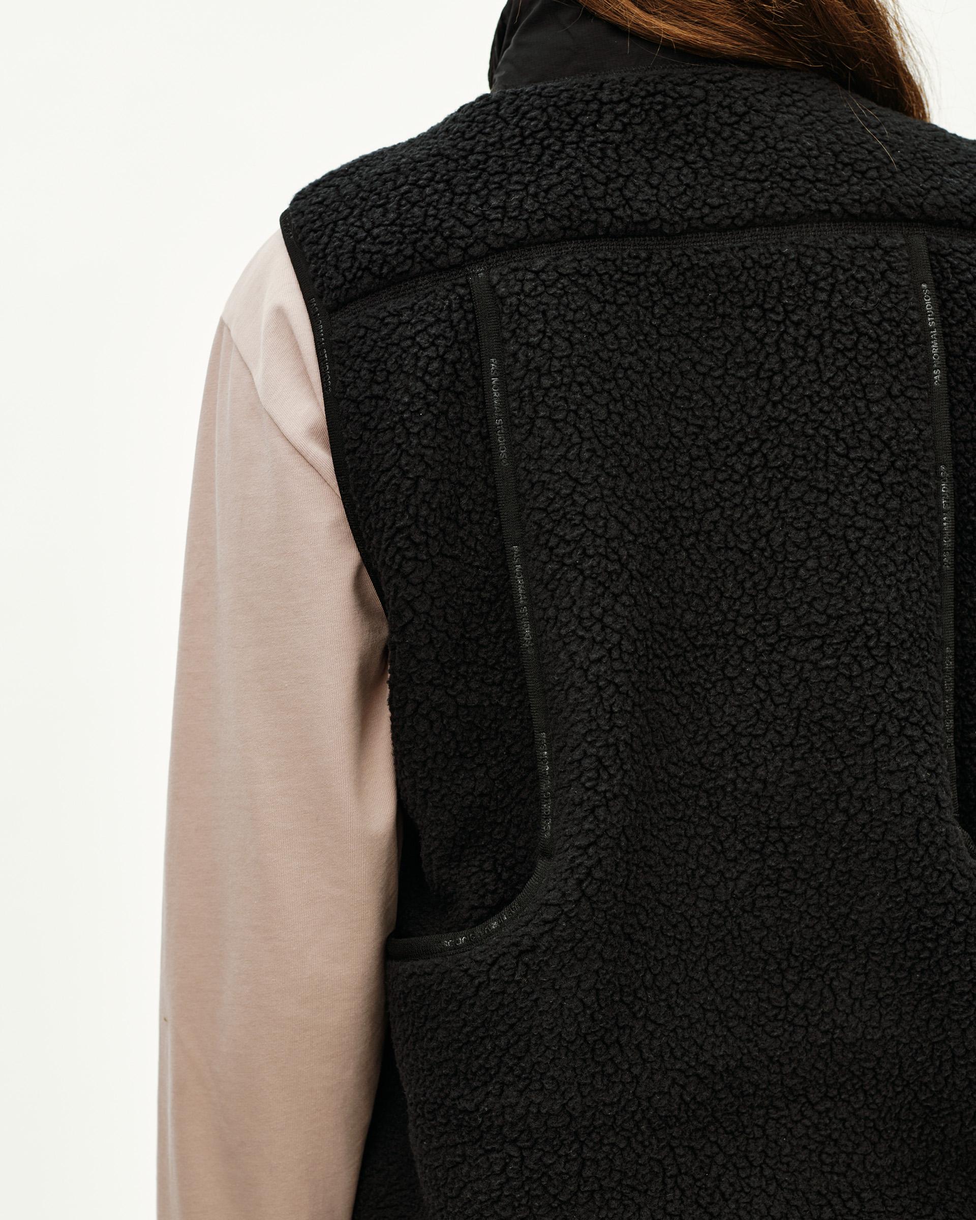 Black Off-Race Pile Fleece Vest, rear detail view on model with sherpa texture and contrast zip trim