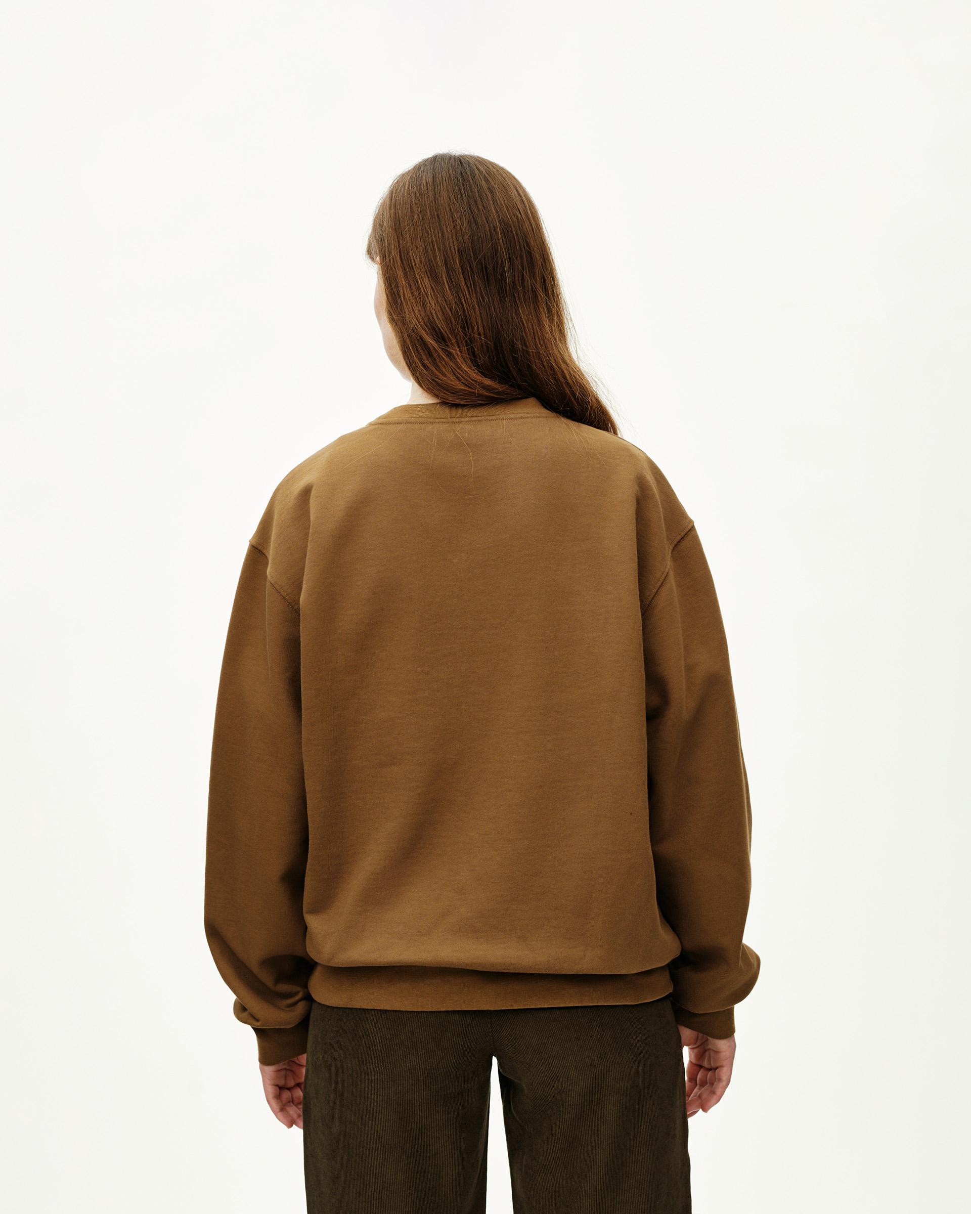 Wood brown Off-Race sweatshirt on model, rear view with ribbed cuffs and hem