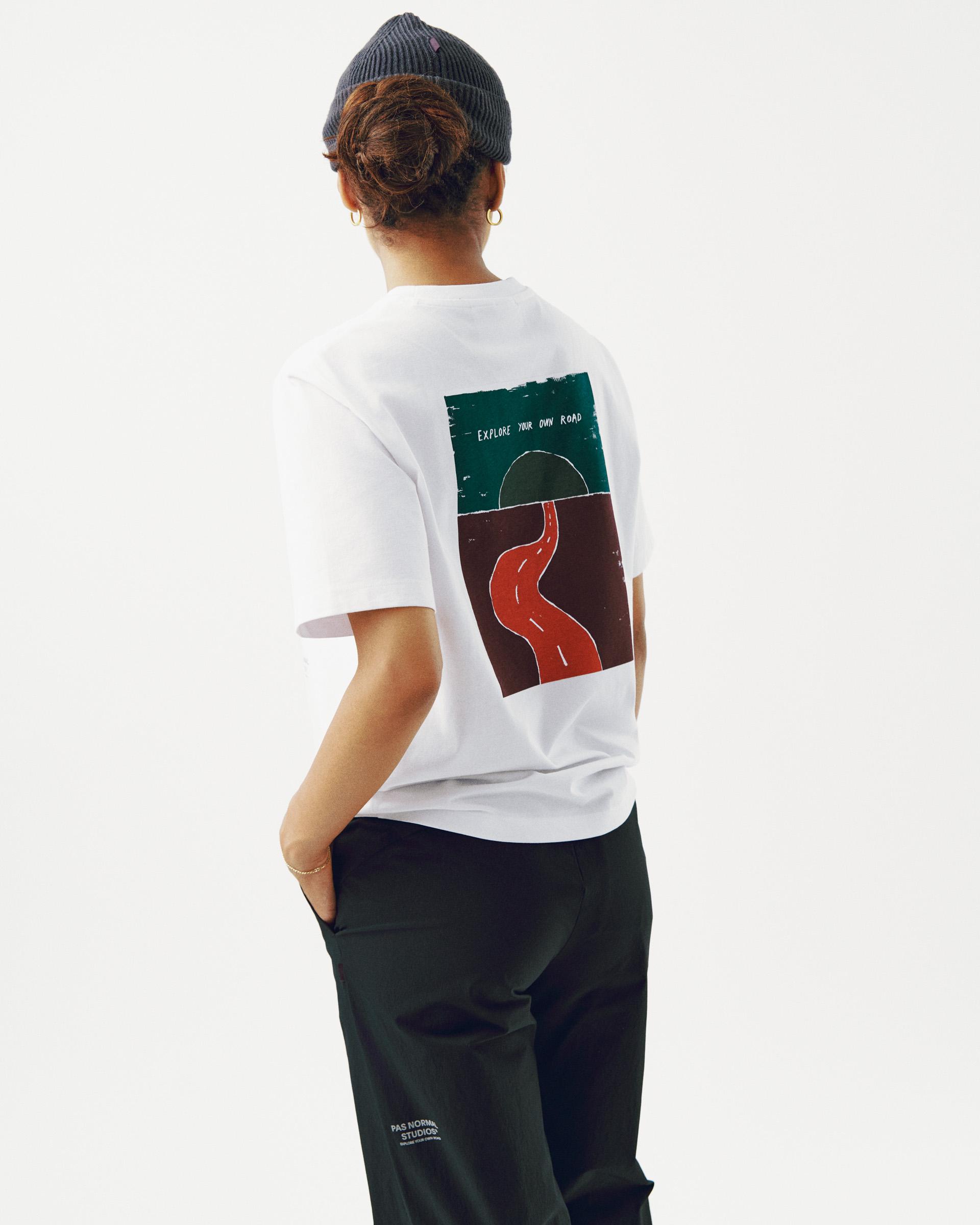 White Off-Race Graphic t-shirt on model, rear view with colorful road graphic print