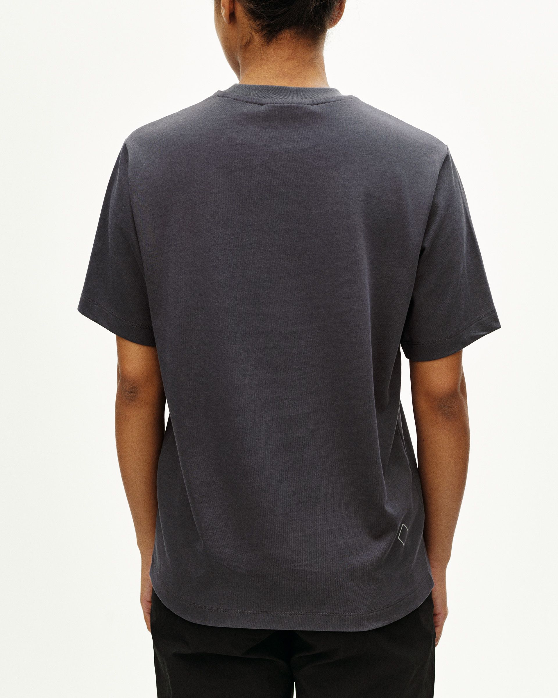 Steel Off-Race t-shirt, rear view on model with small logo detail at hem