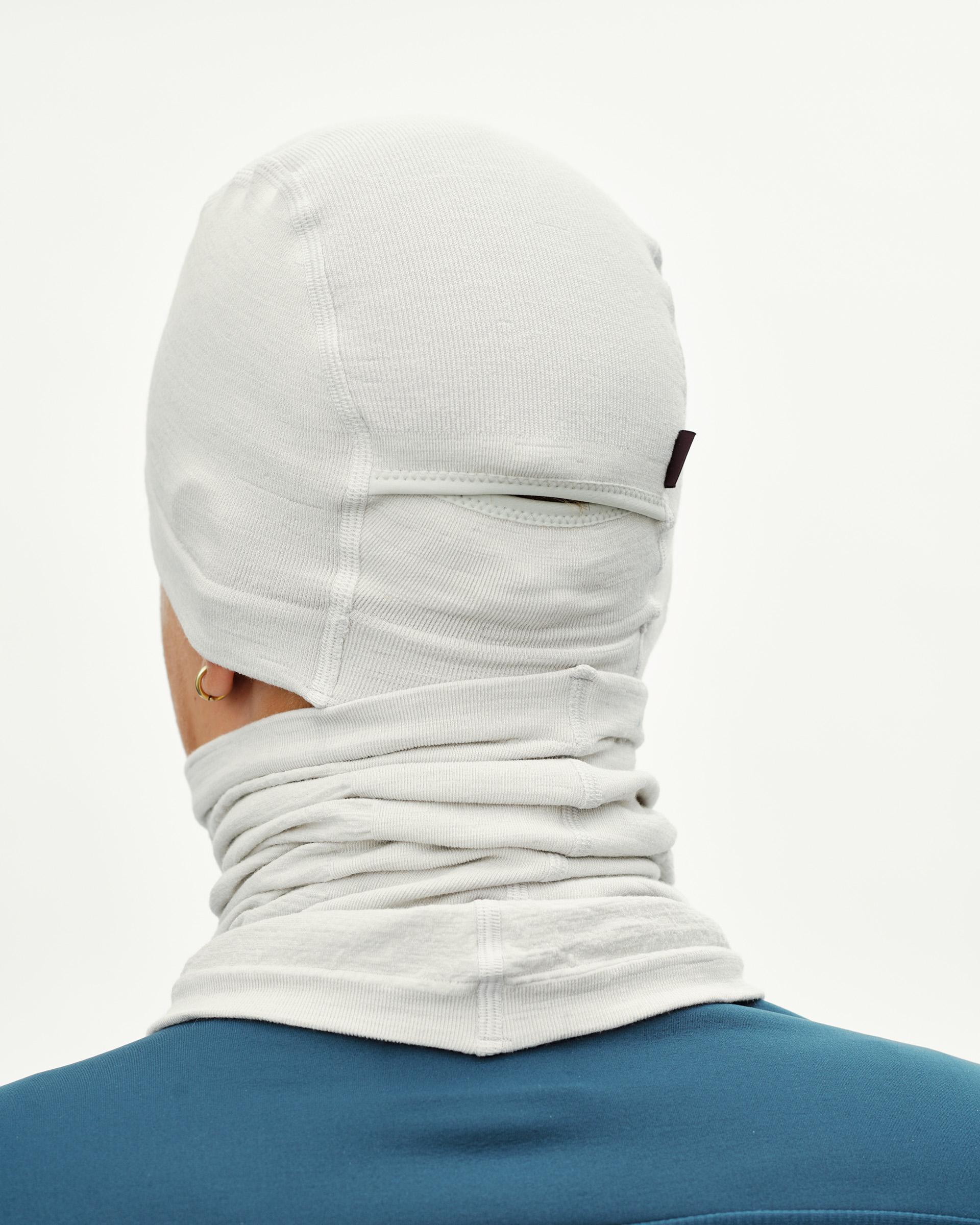 Misty Grey cycling balaclava on model, rear view with gathered neck tube and small woven label