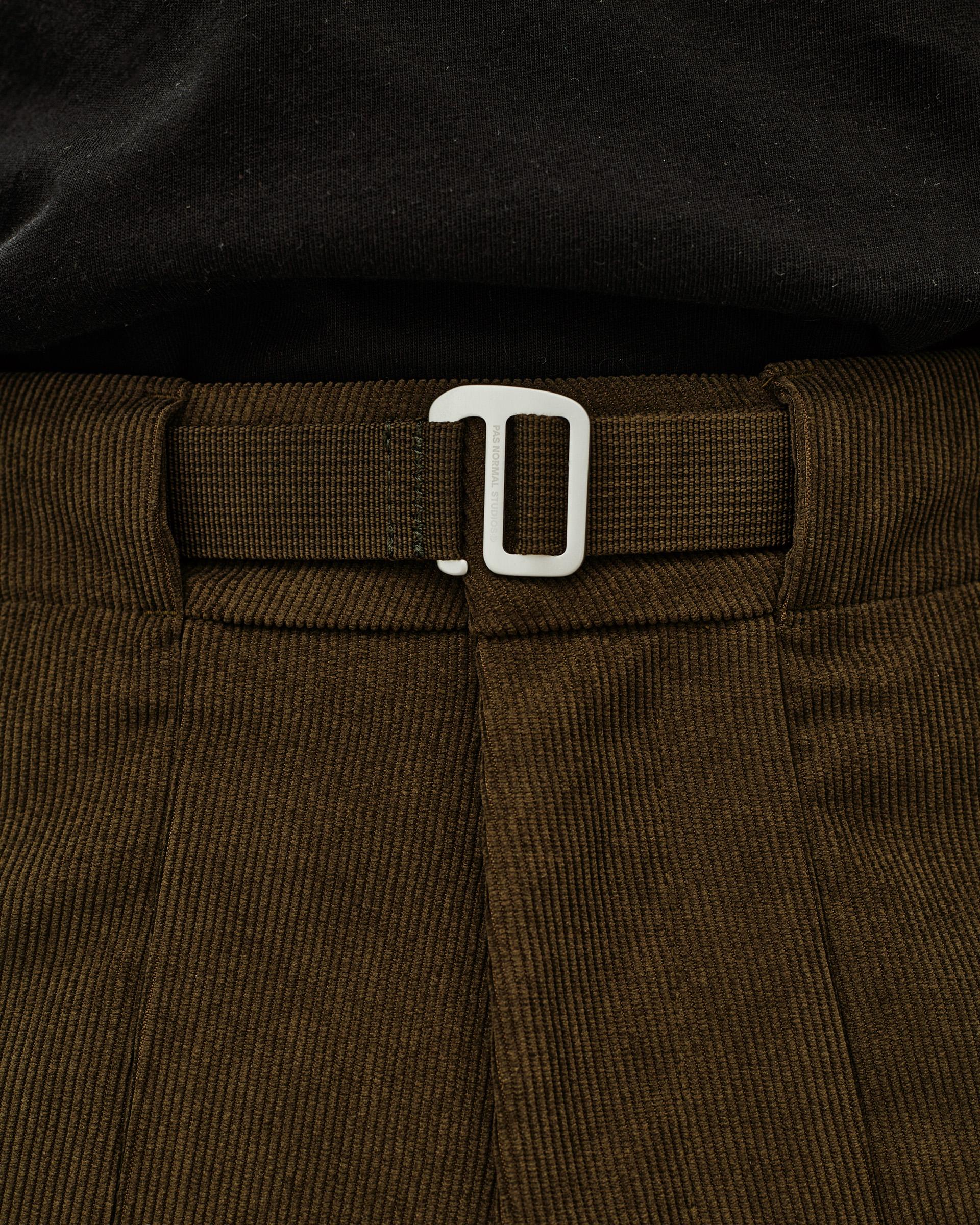 Deep Olive Off-Race Corduroy pants, detail view of waistband with webbing belt and white buckle clasp