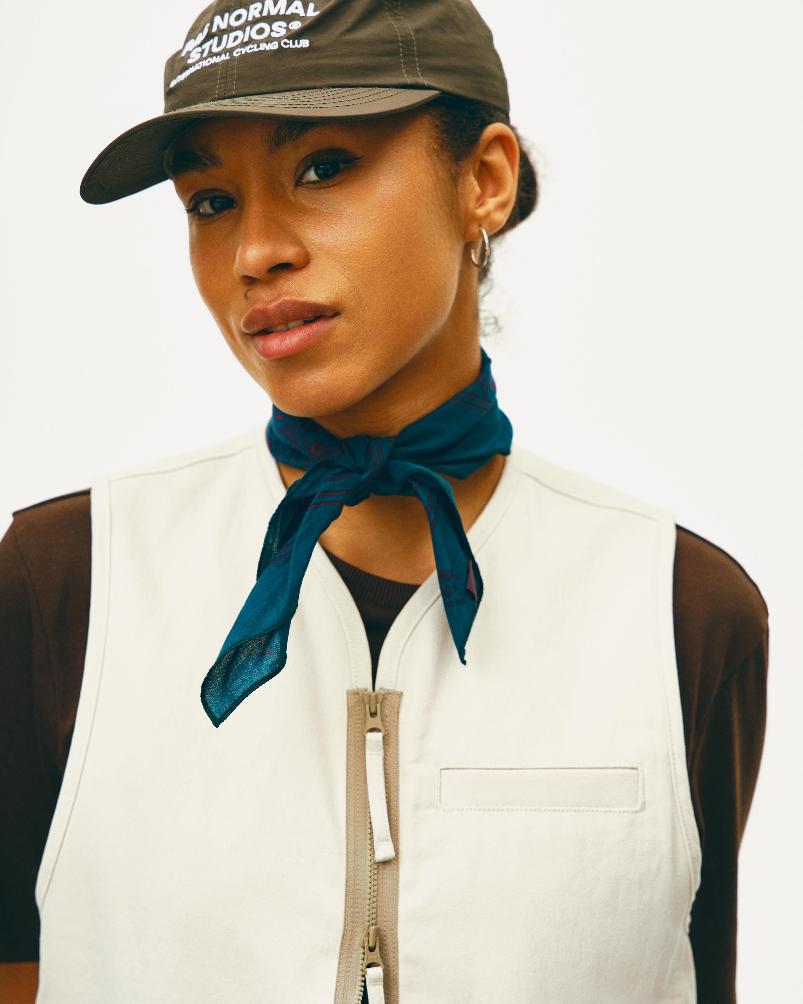 Blue Off-Race bandana on model worn as neck scarf with white contrast stitching